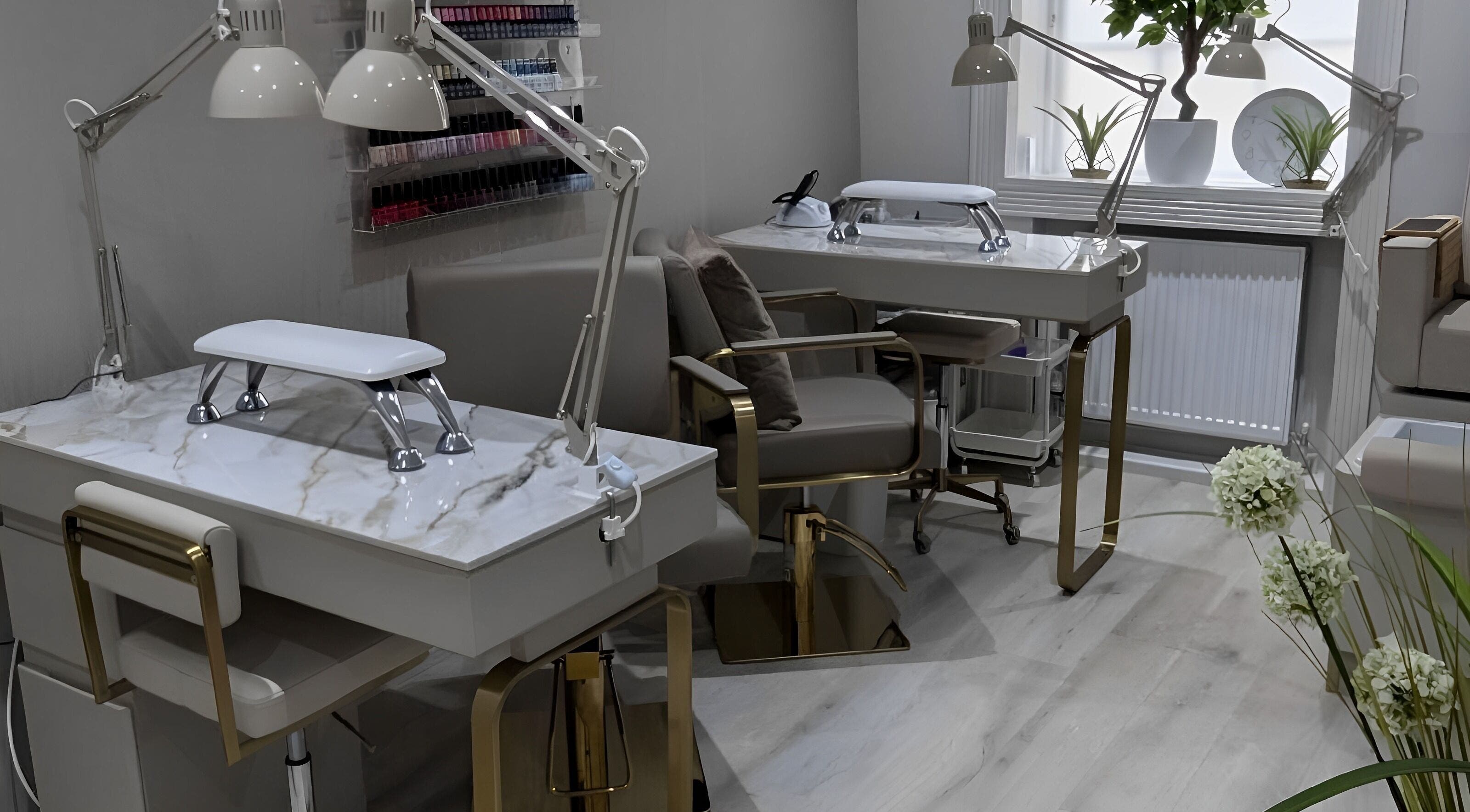 Luxurious nail station at Oxygen Beauty London in London, England, GB featuring chic décor and plush seating.