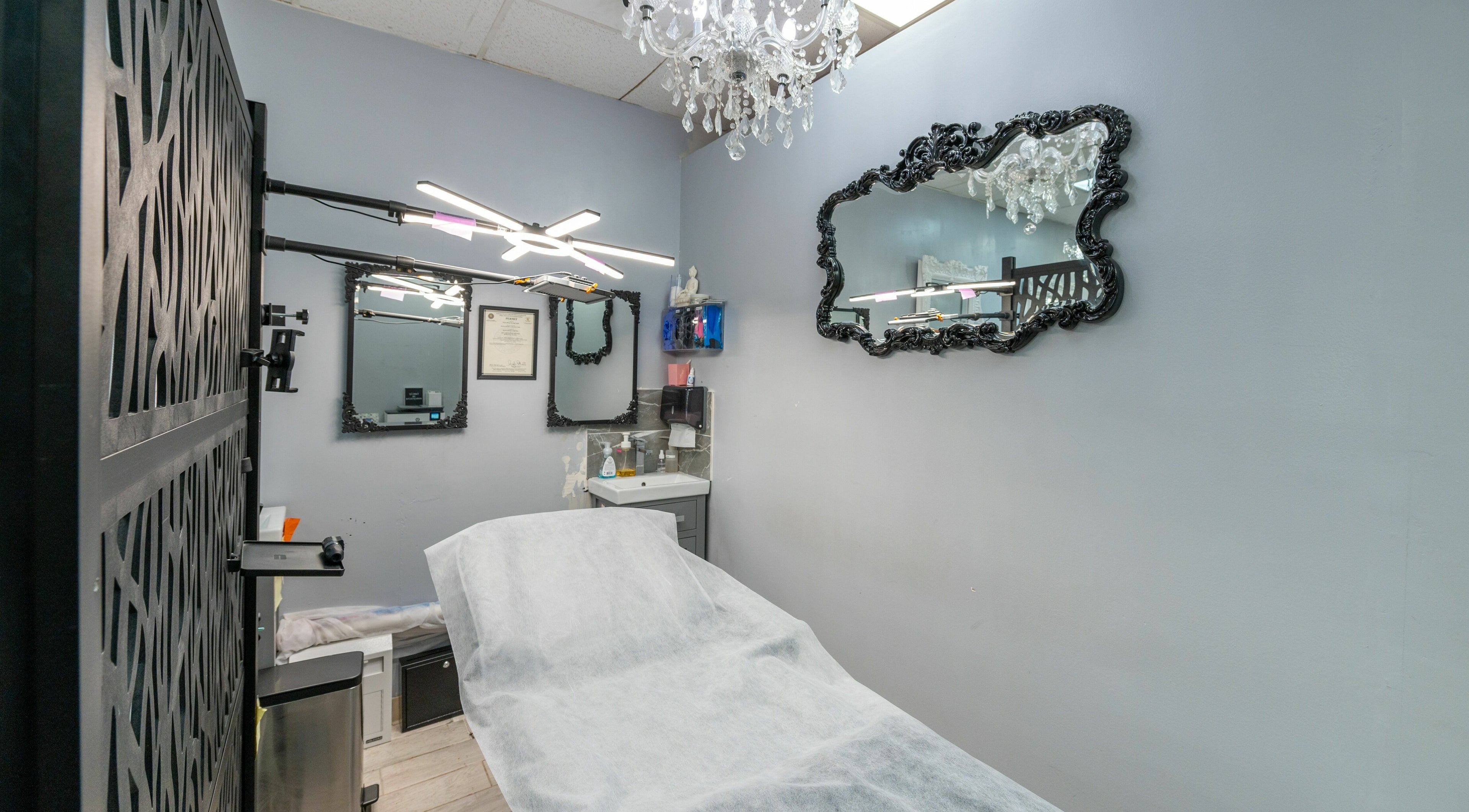 Elegant treatment room at Boom Brows Lash Bar in Bethpage, New York, US with luxurious decor and soft lighting.