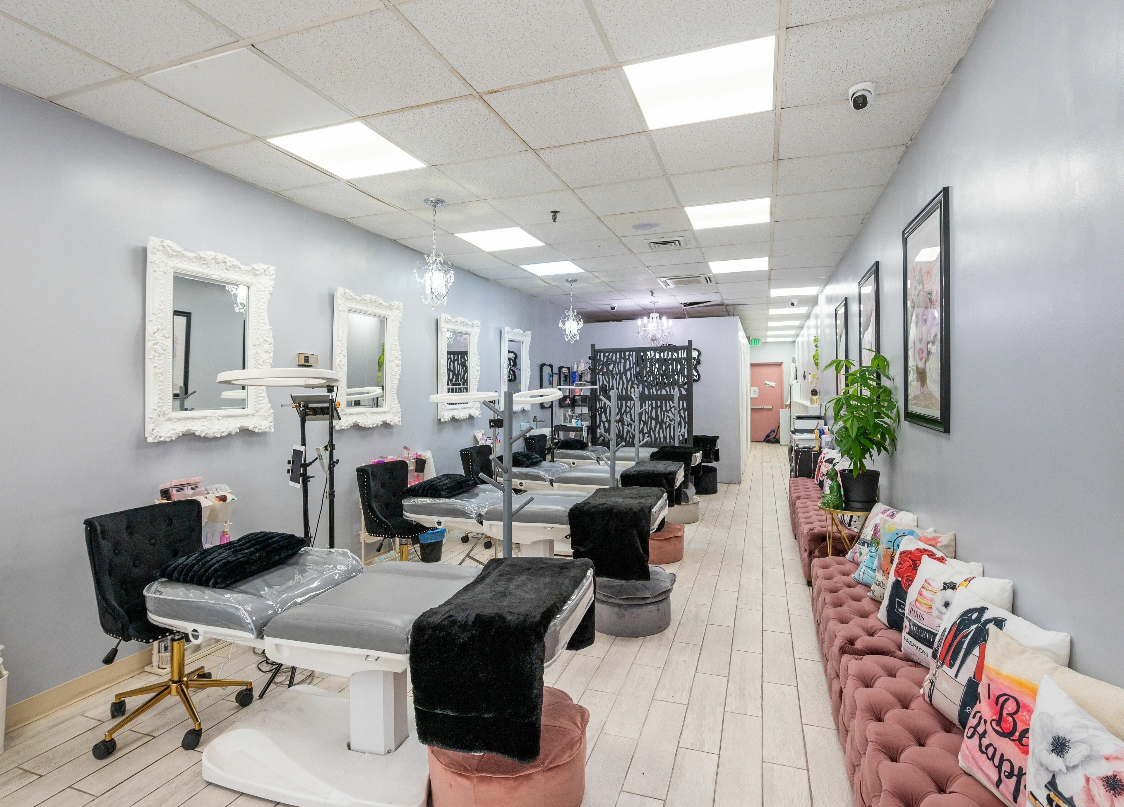Stylish interior of Boom Brows Lash Bar featuring elegant decor and client stations in Bethpage, New York, US.