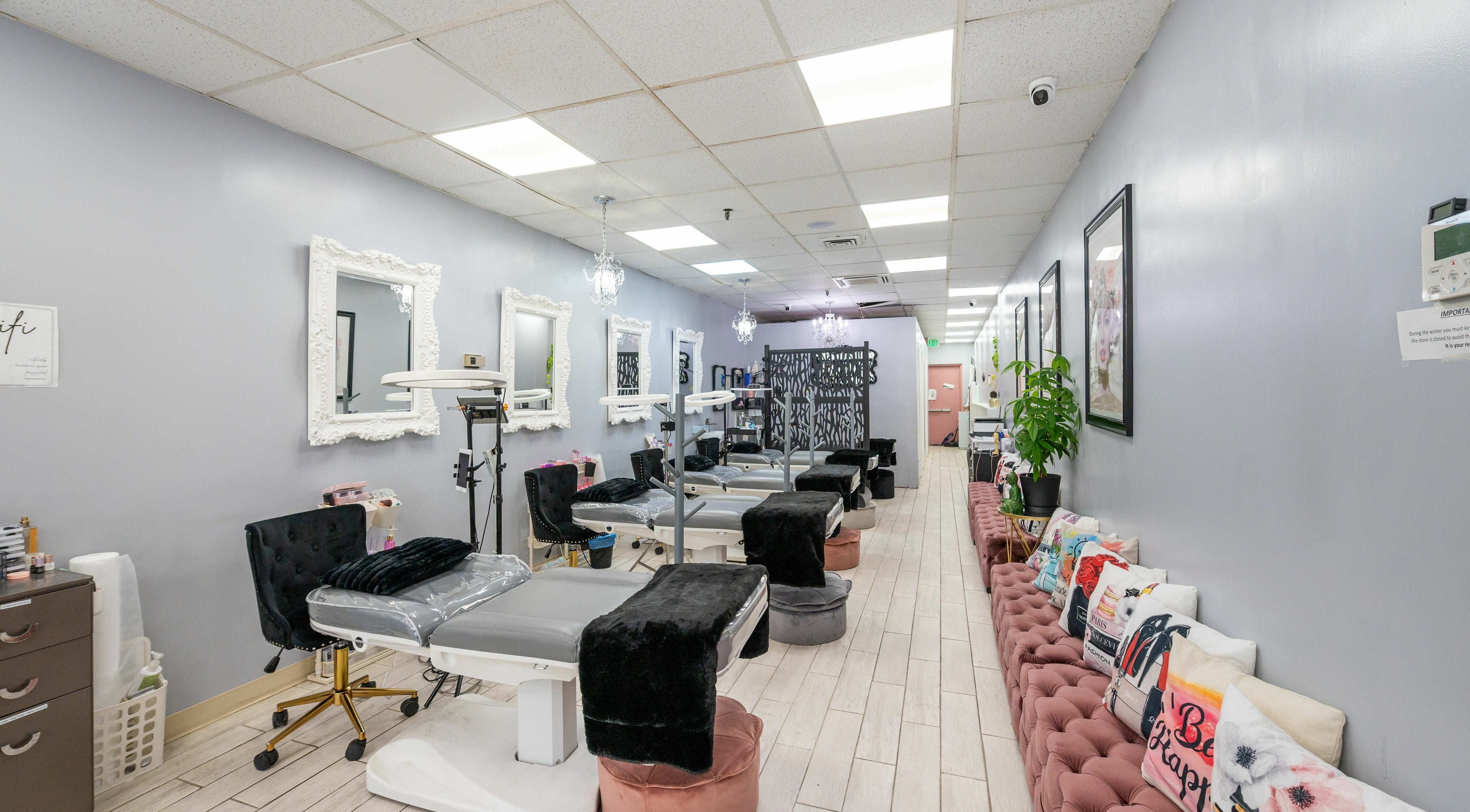 Stylish interior of Boom Brows Lash Bar featuring elegant decor and client stations in Bethpage, New York, US.