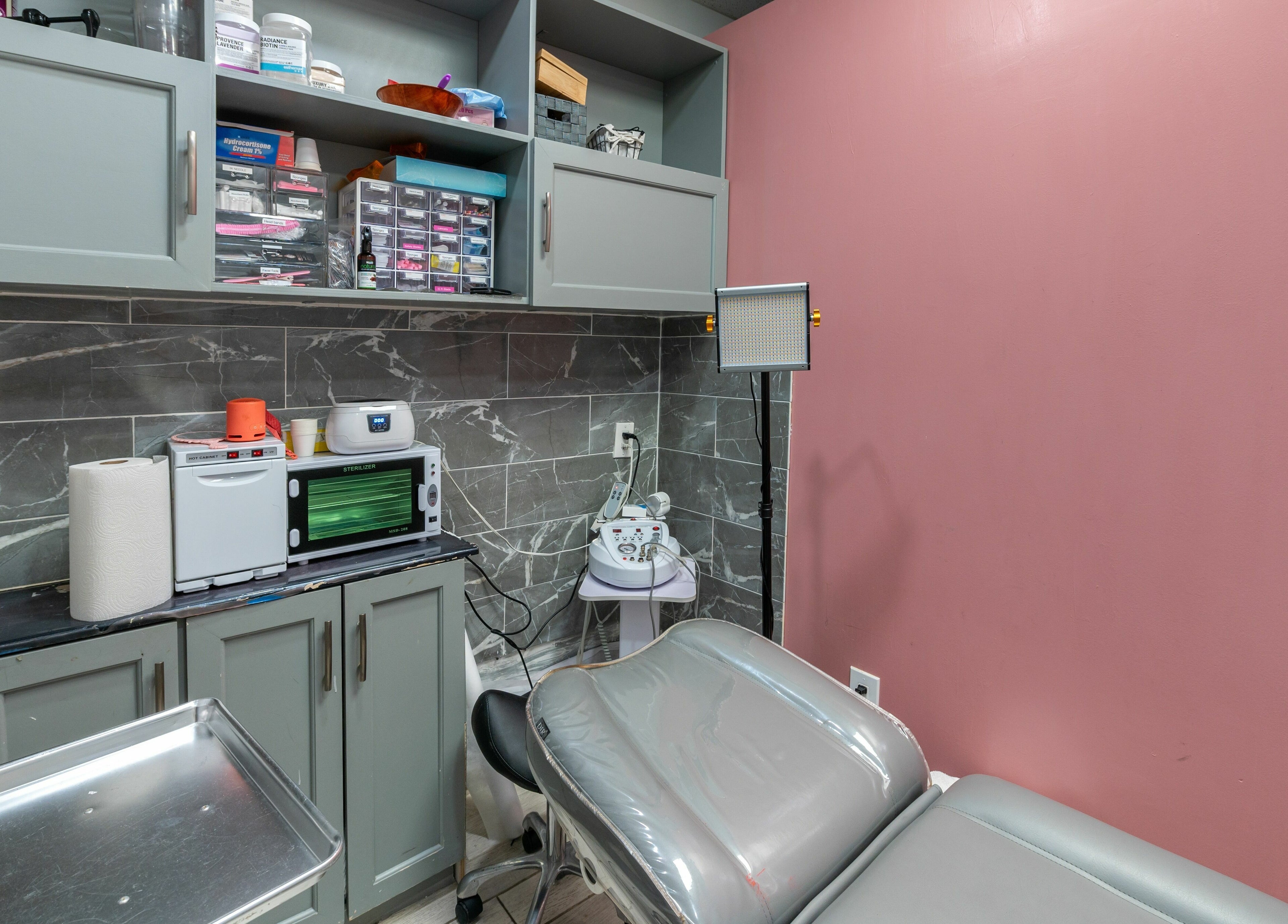 Calm treatment room at Boom Brows Lash Bar in Bethpage, New York, US featuring modern equipment.