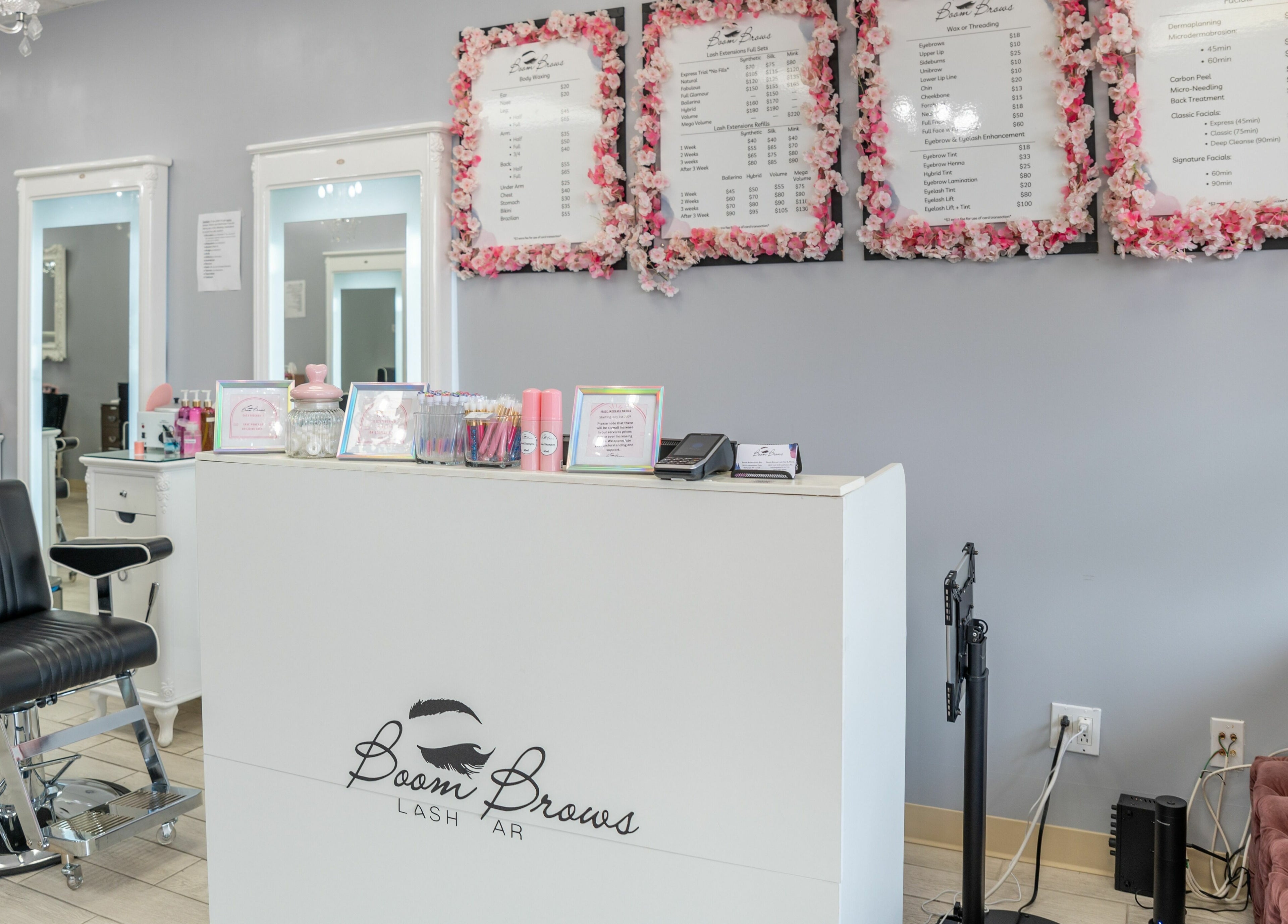 Elegant interior of Boom Brows Lash Bar, Bethpage, New York, US featuring stylish decor and comfortable seating.