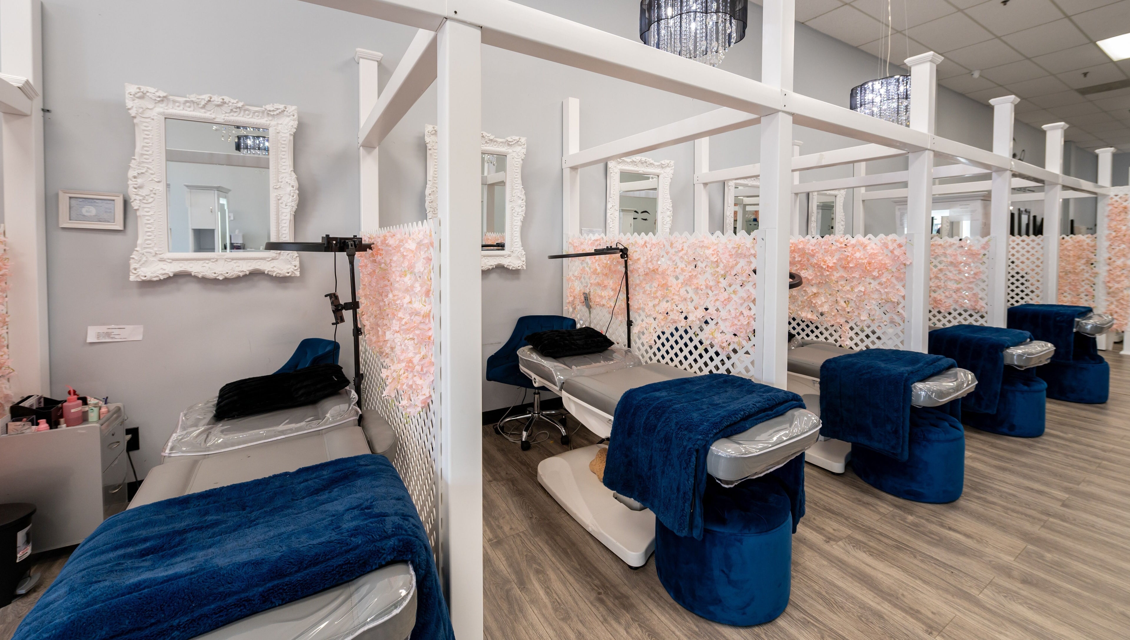 Boom Brows Lash Bar and More in Farmingdale, NY features elegant treatment areas with plush seating and chic decor.