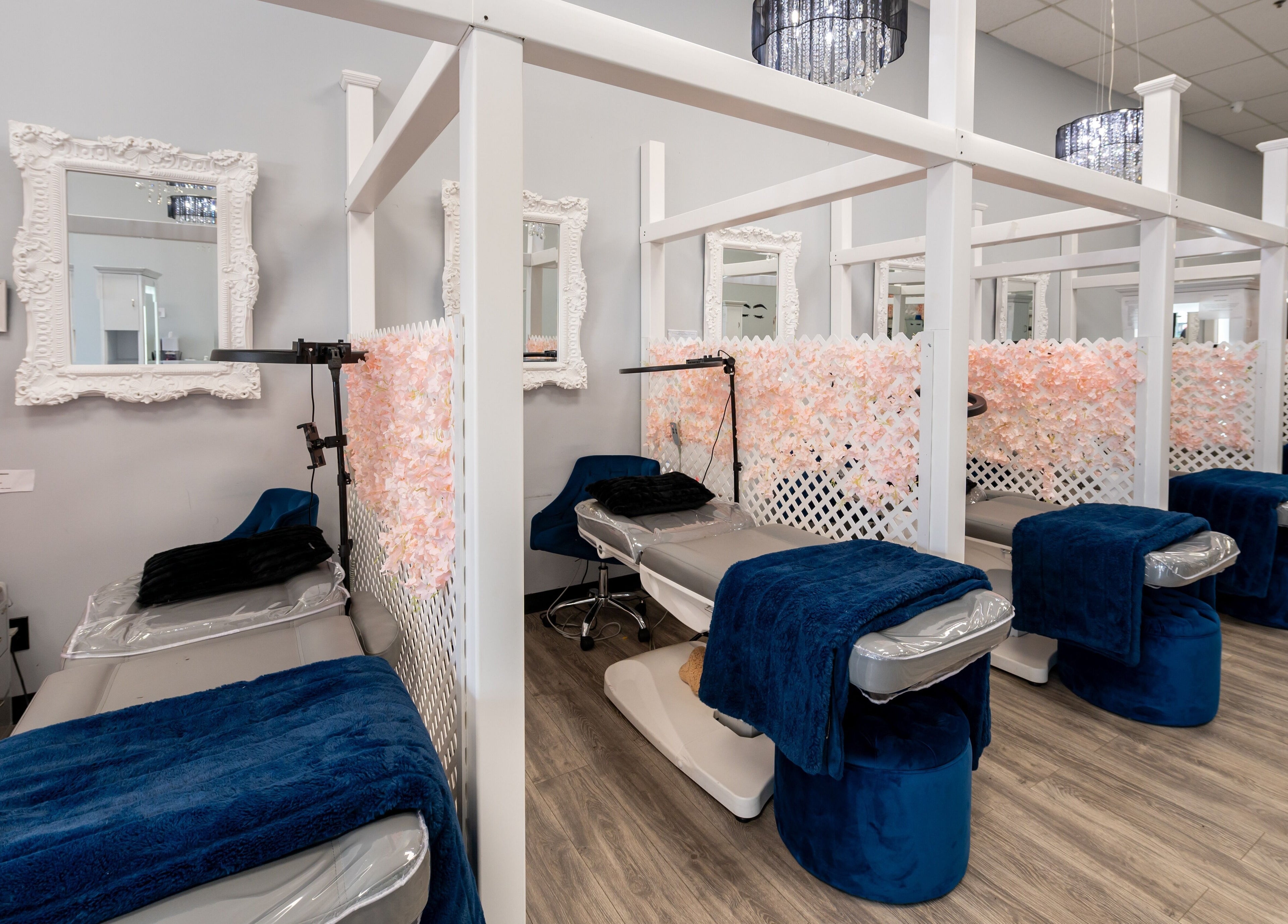 Boom Brows Lash Bar and More in Farmingdale, NY features elegant treatment areas with plush seating and chic decor.