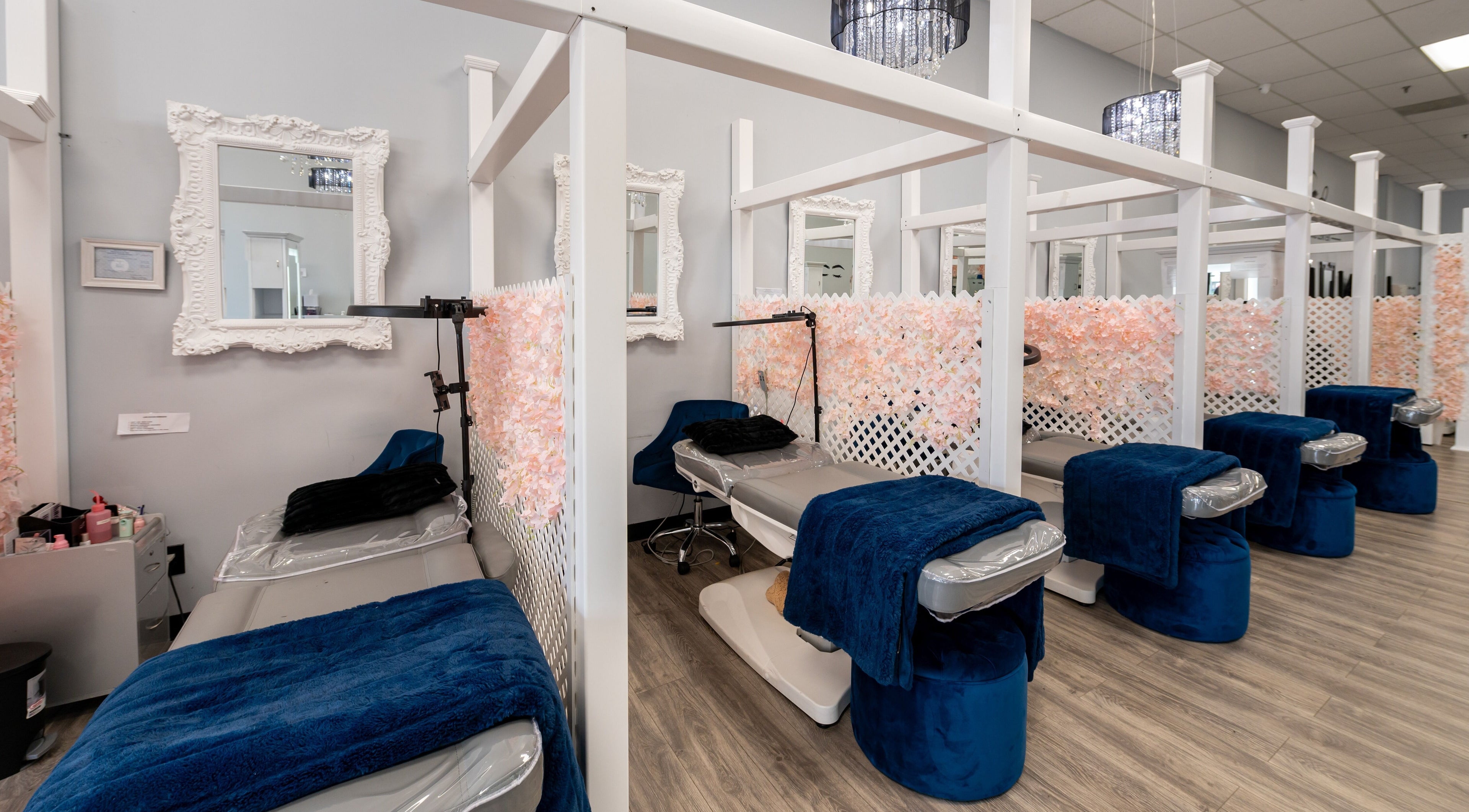 Boom Brows Lash Bar and More in Farmingdale, NY features elegant treatment areas with plush seating and chic decor.