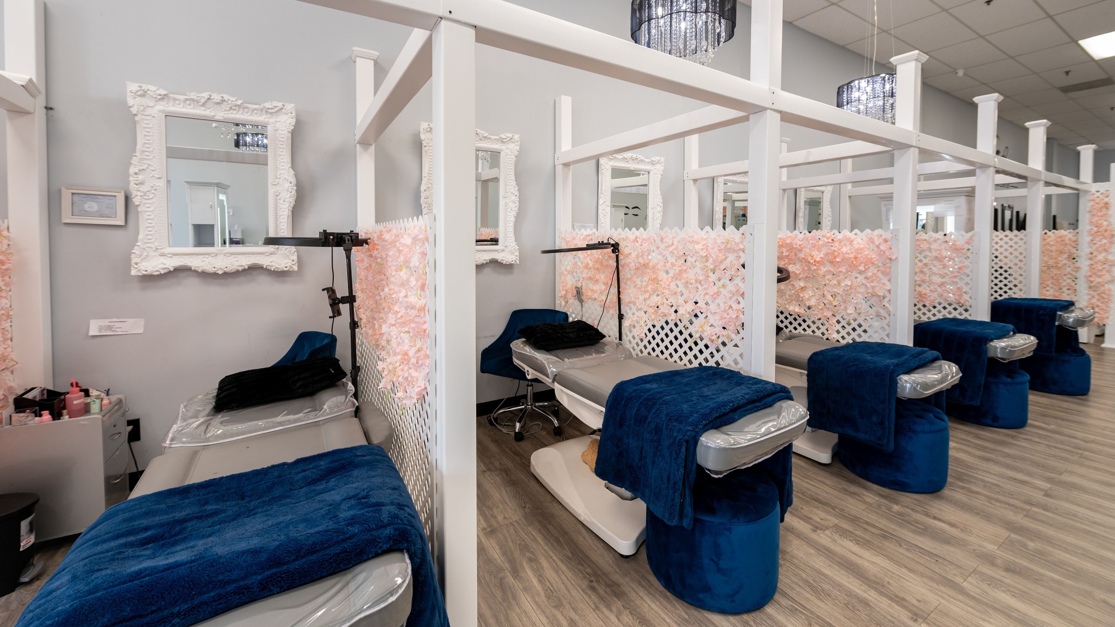 Boom Brows Lash Bar and More in Farmingdale, NY features elegant treatment areas with plush seating and chic decor.