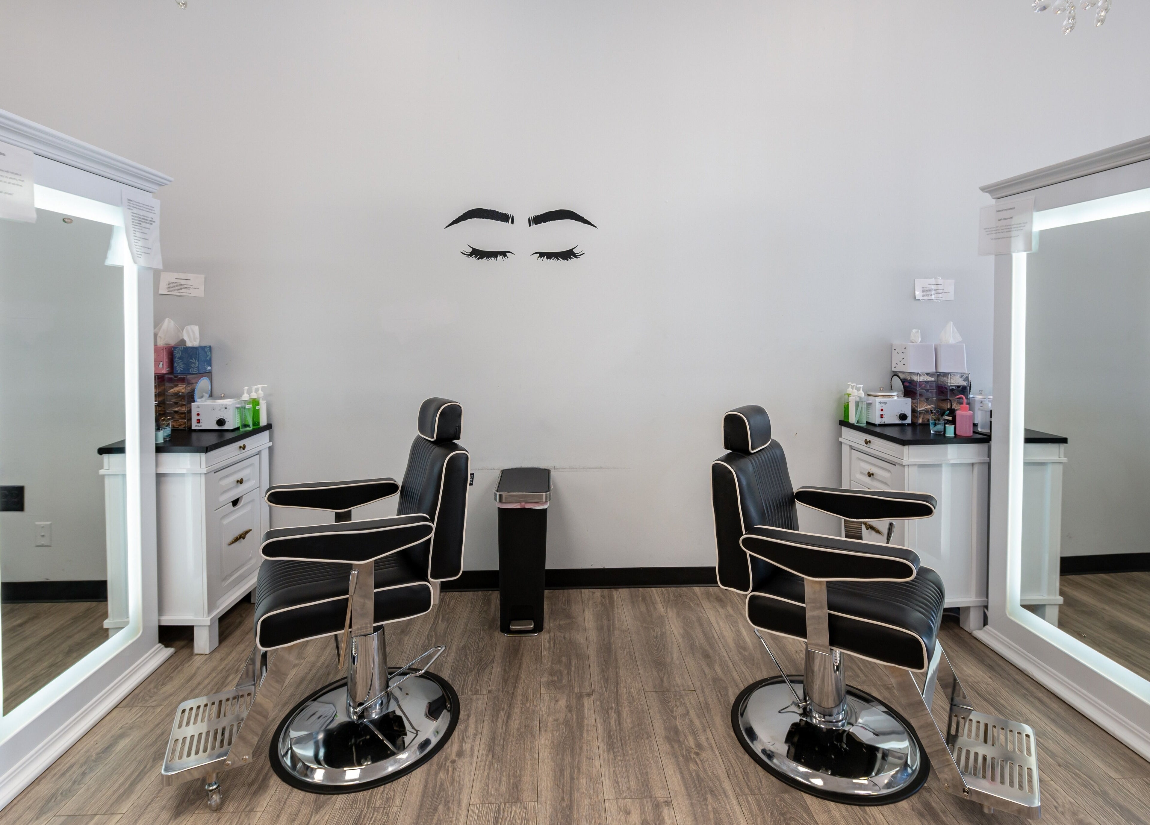 Elegant salon chairs and mirrors at Boom Brows Lash Bar and More, Farmingdale, New York, US.