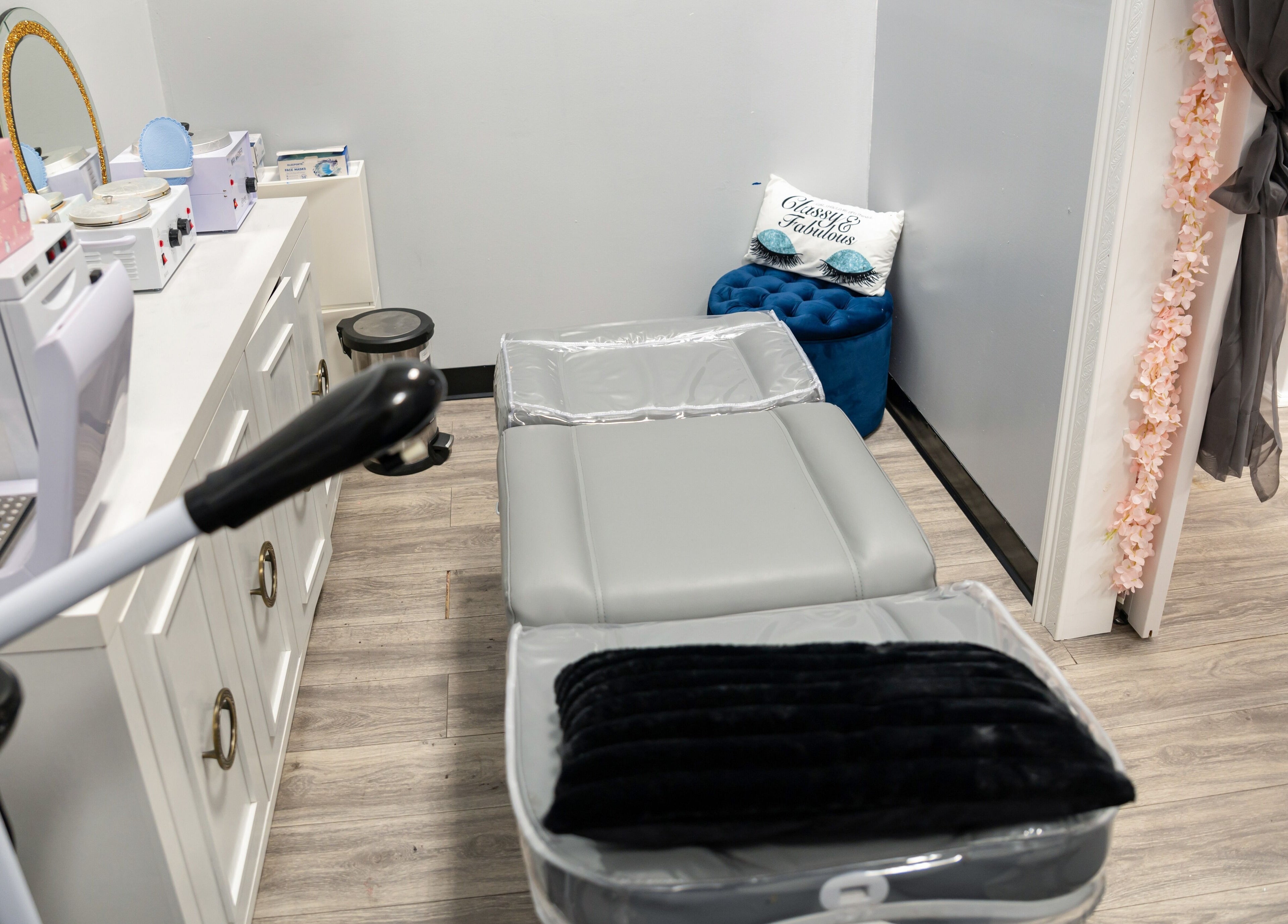 Relaxing lash room at Boom Brows Lash Bar and More in Farmingdale, New York, US, featuring professional equipment.