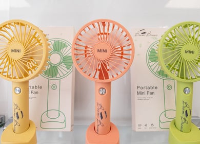 Colorful mini fans at Boom Brows Lash Bar By Liz, Massapequa Park, New York, US, stylish decor detail.