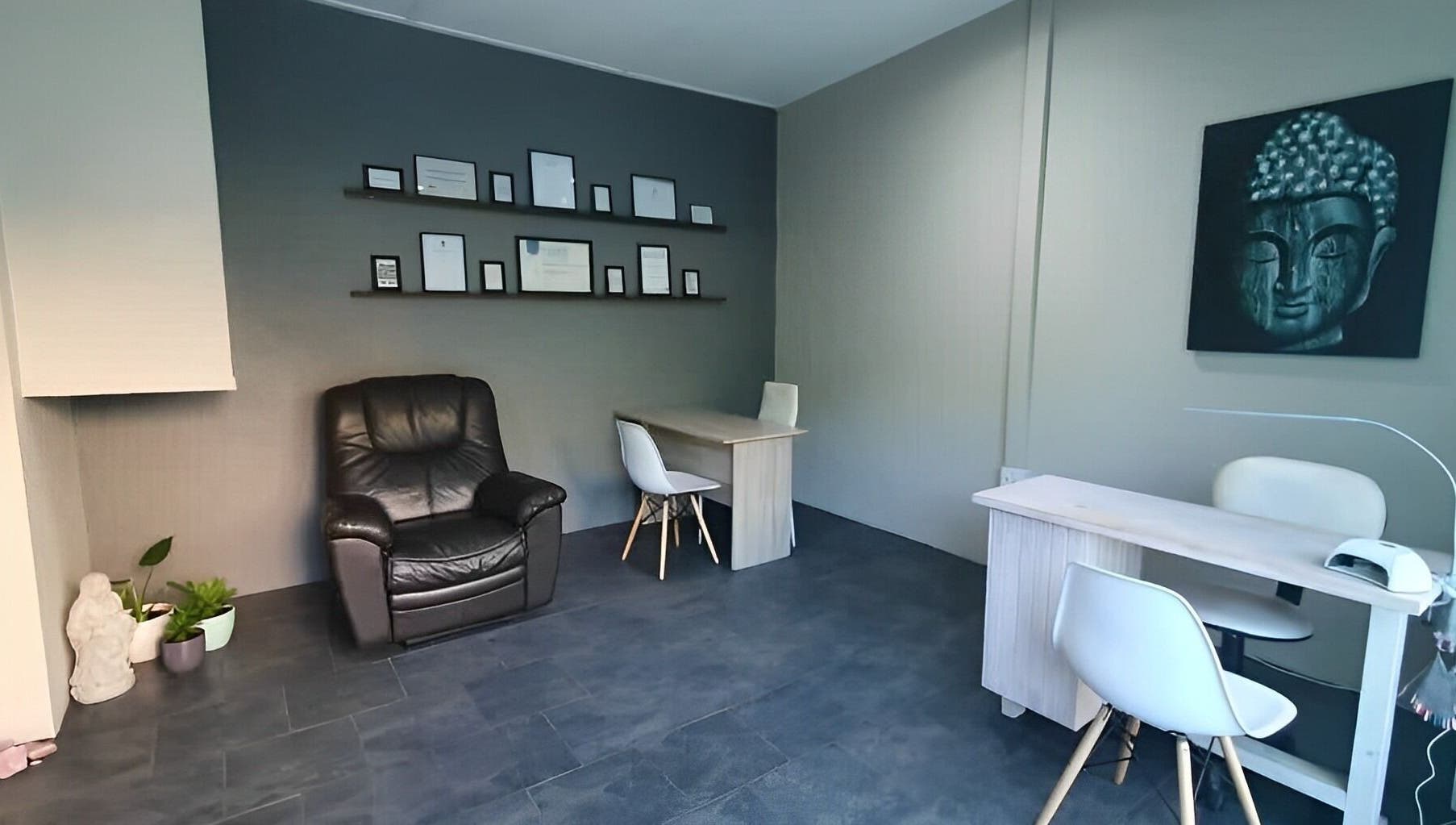 Cozy ALS Beauty lounge in Cape Town, Western Cape, ZA with Buddha art and seating area.