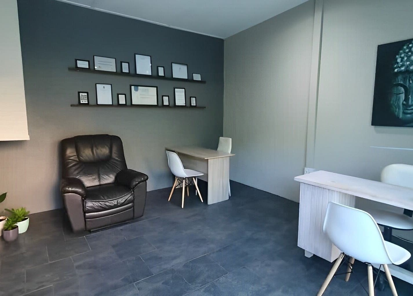 Cozy ALS Beauty lounge in Cape Town, Western Cape, ZA with Buddha art and seating area.