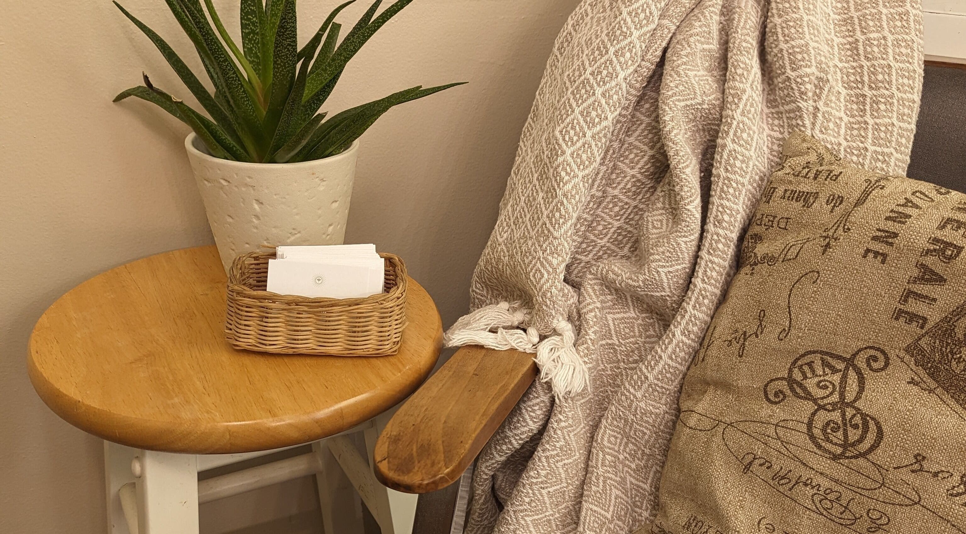 Relaxing seating area with plant at Studio 19 Salon, Goshen, Indiana, US.