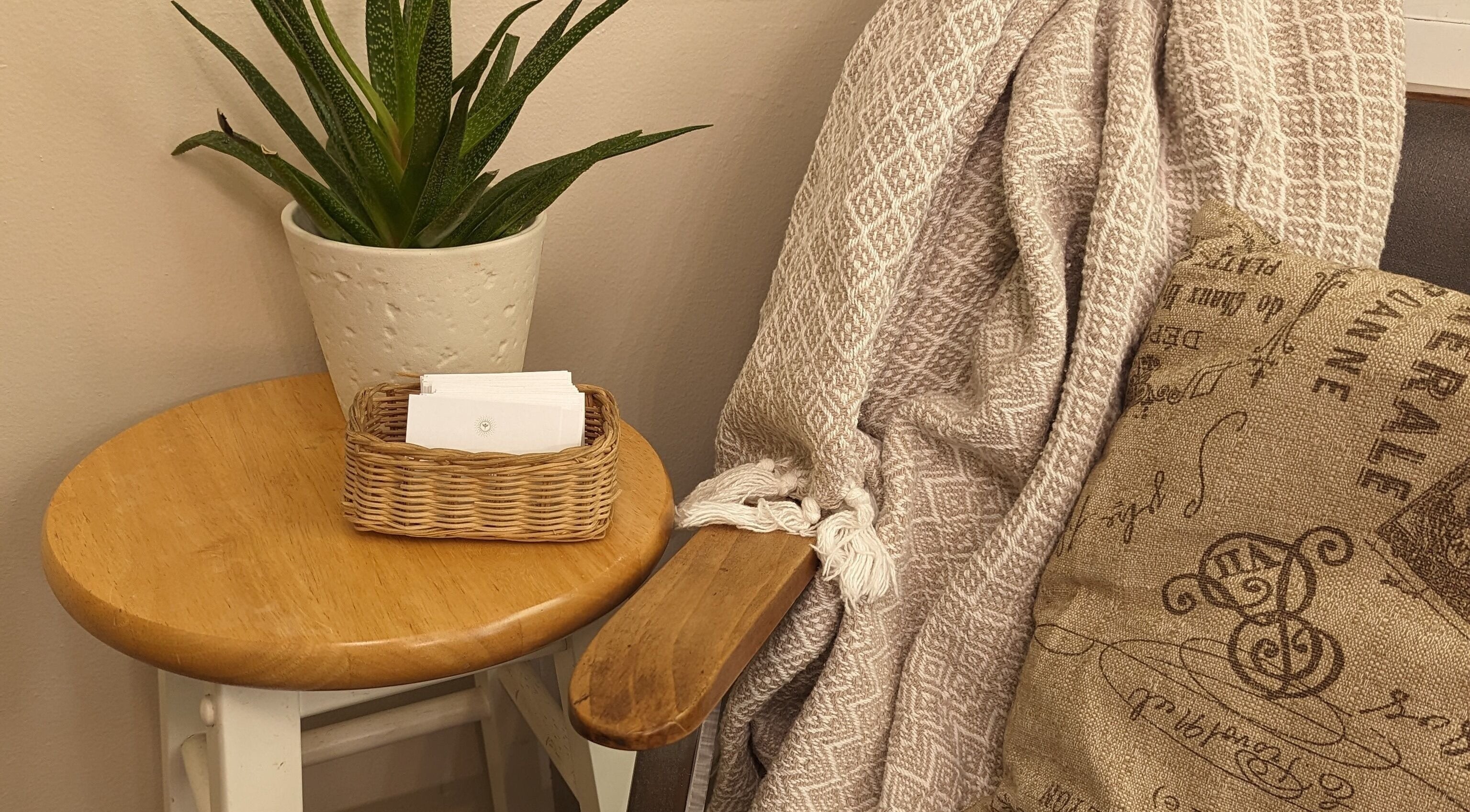Relaxing seating area with plant at Studio 19 Salon, Goshen, Indiana, US.