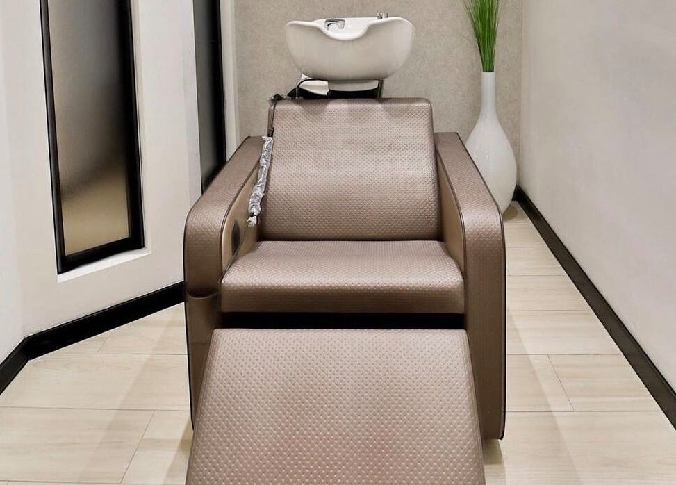 Elegant wash station at Elena Salon Sliema, Sliema, MT. Modern styling chair enhances your beauty experience.