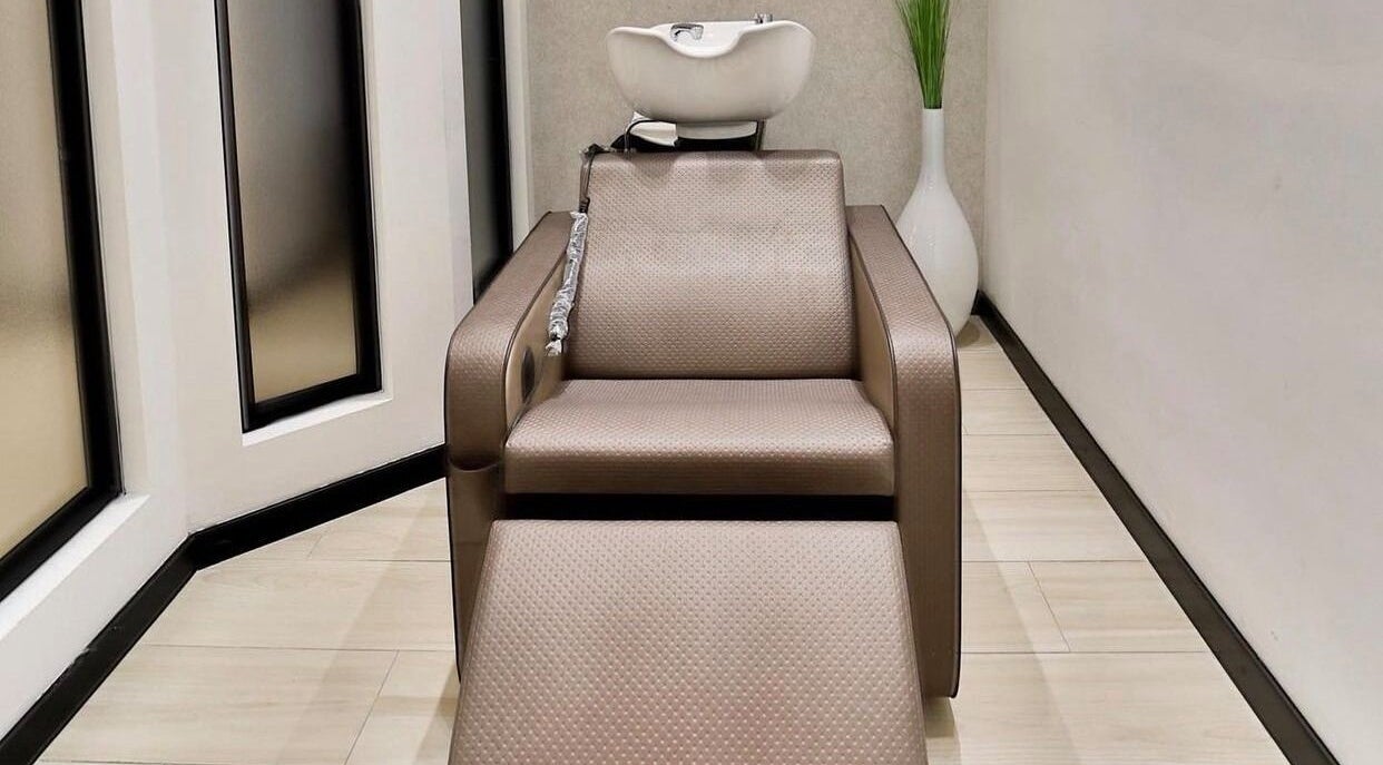 Elegant wash station at Elena Salon Sliema, Sliema, MT. Modern styling chair enhances your beauty experience.