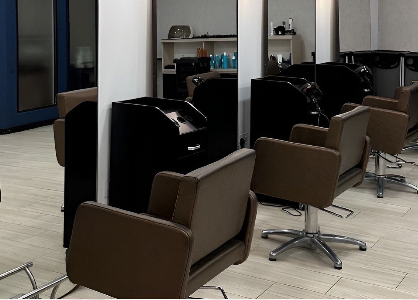 Modern interior of Elena Salon Sliema with stylish chairs and mirrors, located in Sliema, MT.