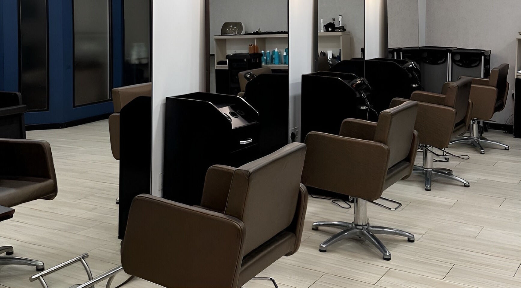 Modern interior of Elena Salon Sliema with stylish chairs and mirrors, located in Sliema, MT.