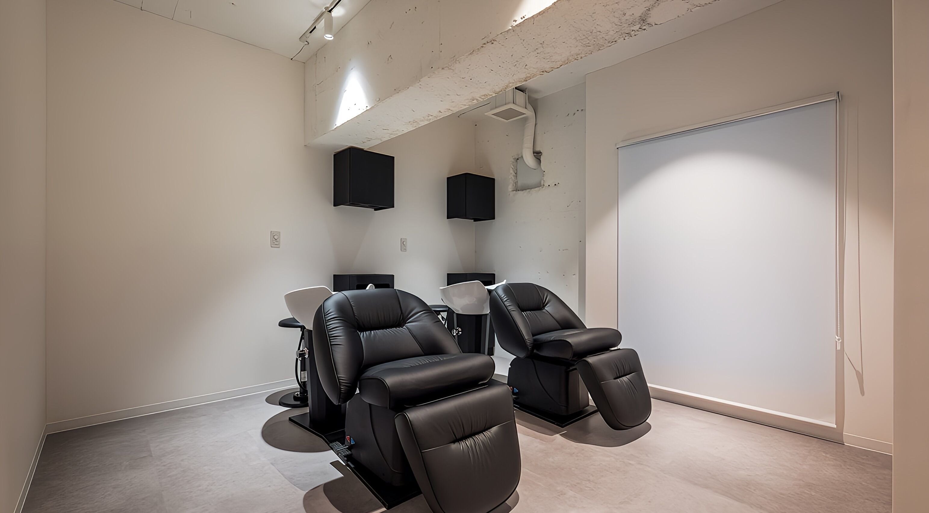Relaxing black chairs in a modern studio at FÈATH, Minato City, Tokyo, JP.
