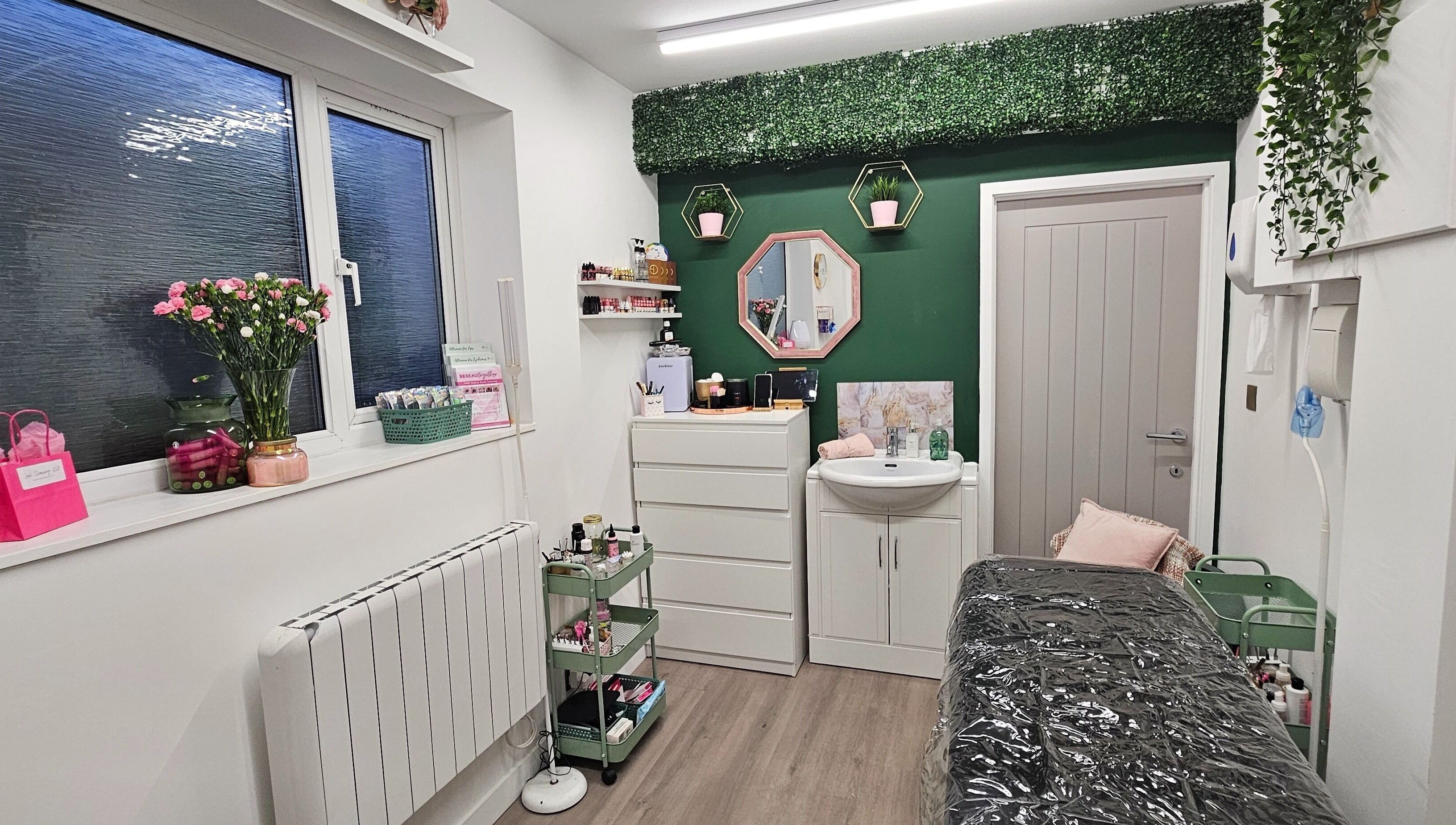 Cozy treatment room at Be Beau With Grace, Rochdale, England, GB with floral decor and relaxing ambiance.