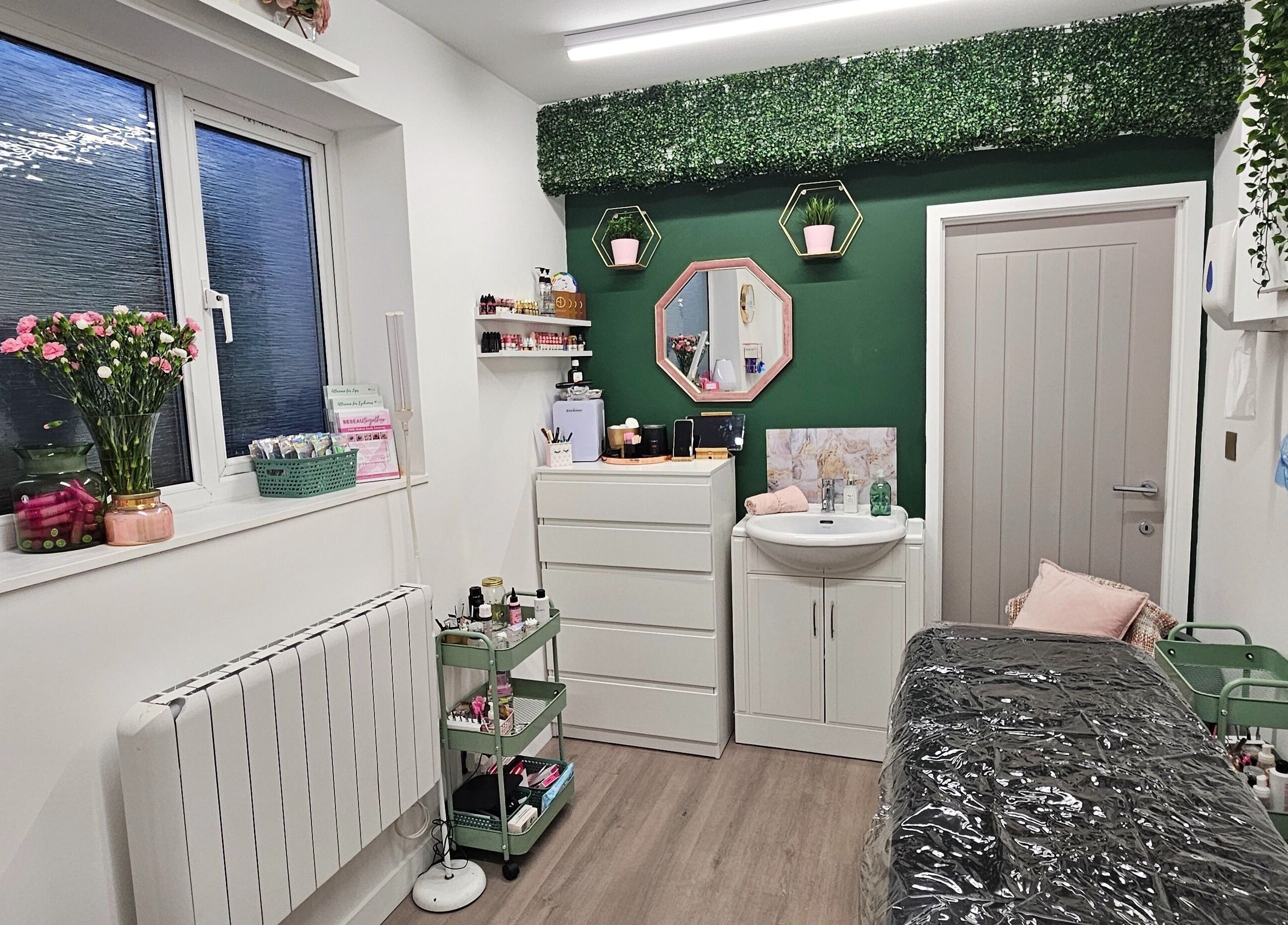 Cozy treatment room at Be Beau With Grace, Rochdale, England, GB with floral decor and relaxing ambiance.