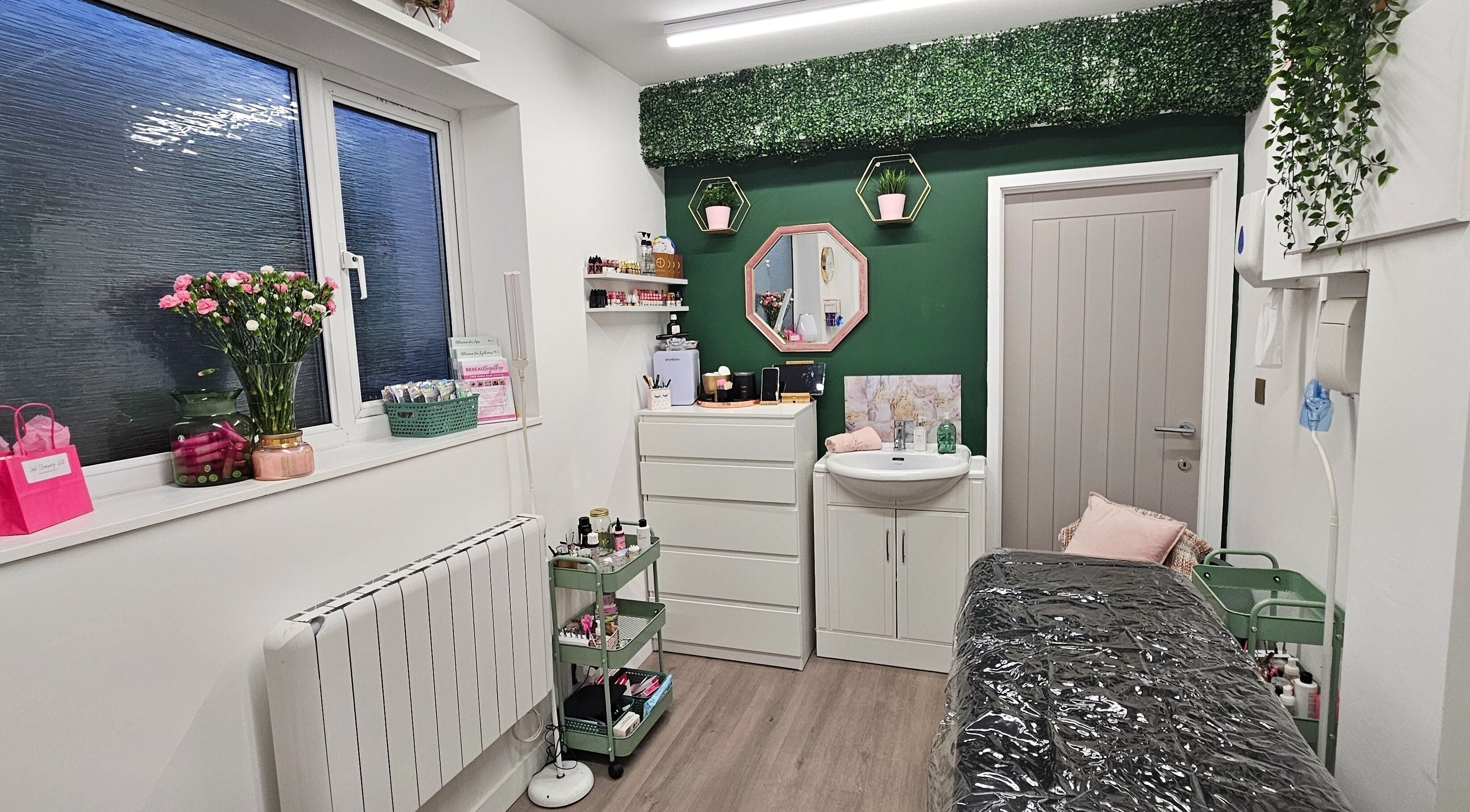 Cozy treatment room at Be Beau With Grace, Rochdale, England, GB with floral decor and relaxing ambiance.