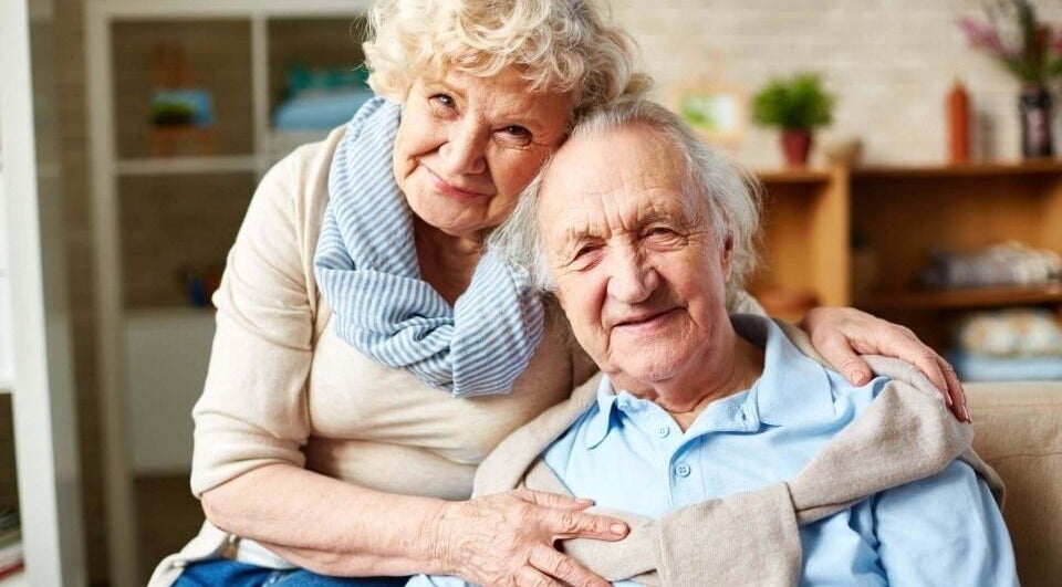 Happy elderly couple at Wired Counselling Service Wirral, England, GB, sharing a comforting moment.