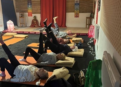 Group yoga session at Wired Counselling Service Wirral, cozy room, Wirral, England, GB.