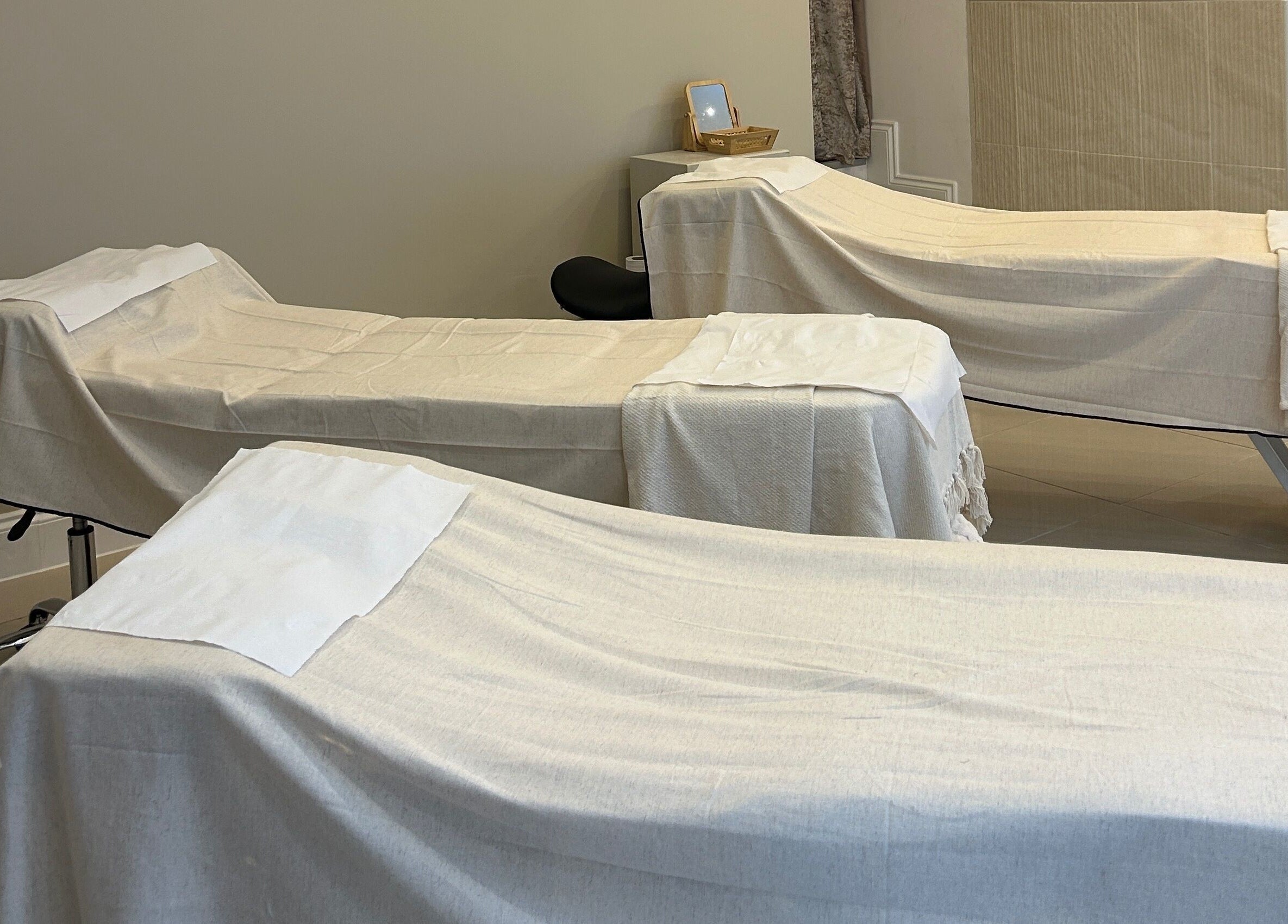 Peaceful spa treatment beds at Ellie Glover Beauty in Lowestoft, England, GB for ultimate relaxation.
