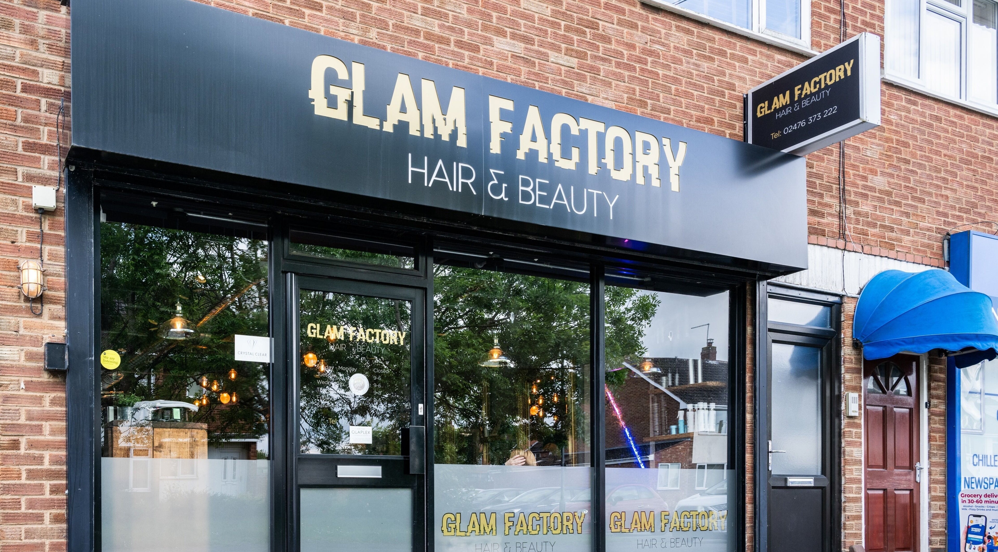 Front view of Glam Factory, a beauty salon in Nuneaton, England, GB, showcasing its elegant exterior signage.