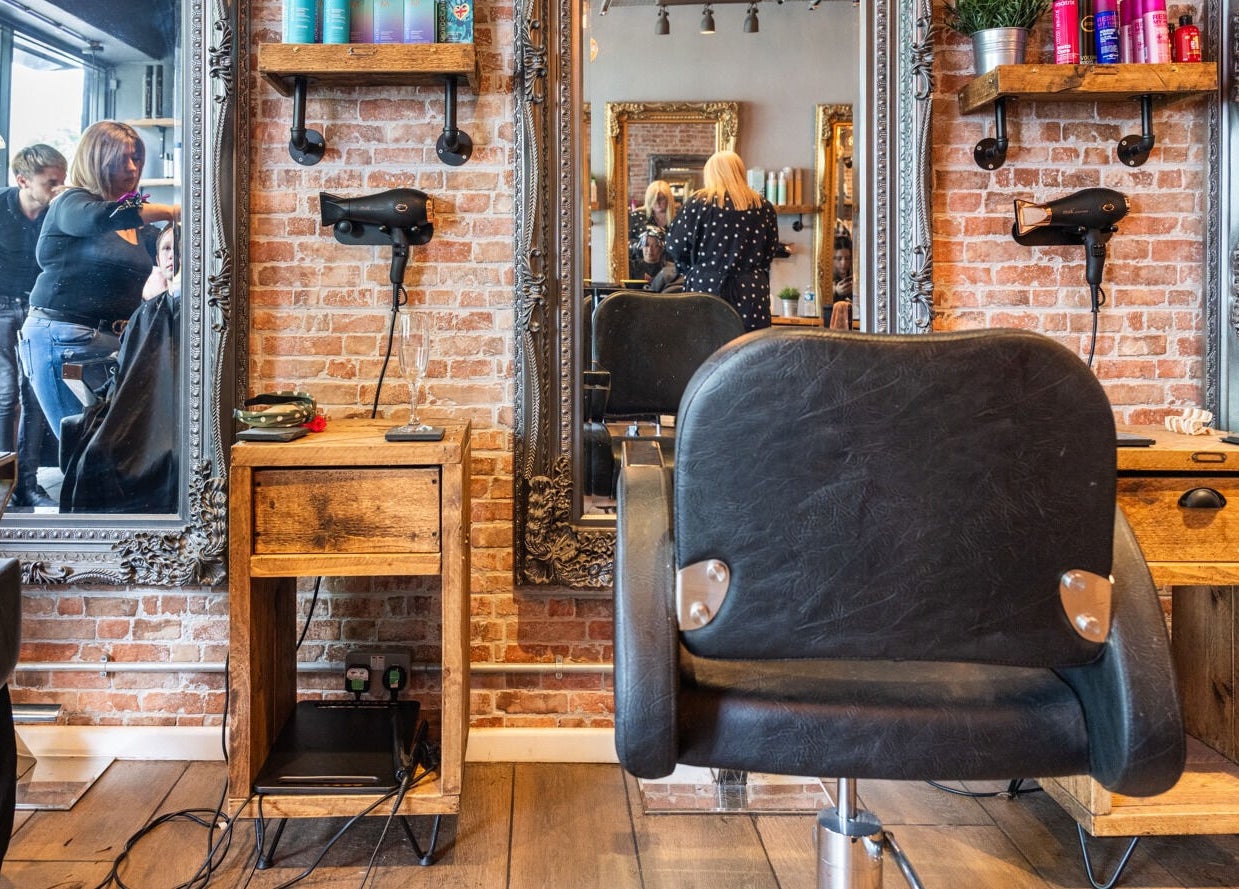 Spacious Glam Factory salon with stylish decor and mirrors in Nuneaton, England, GB.