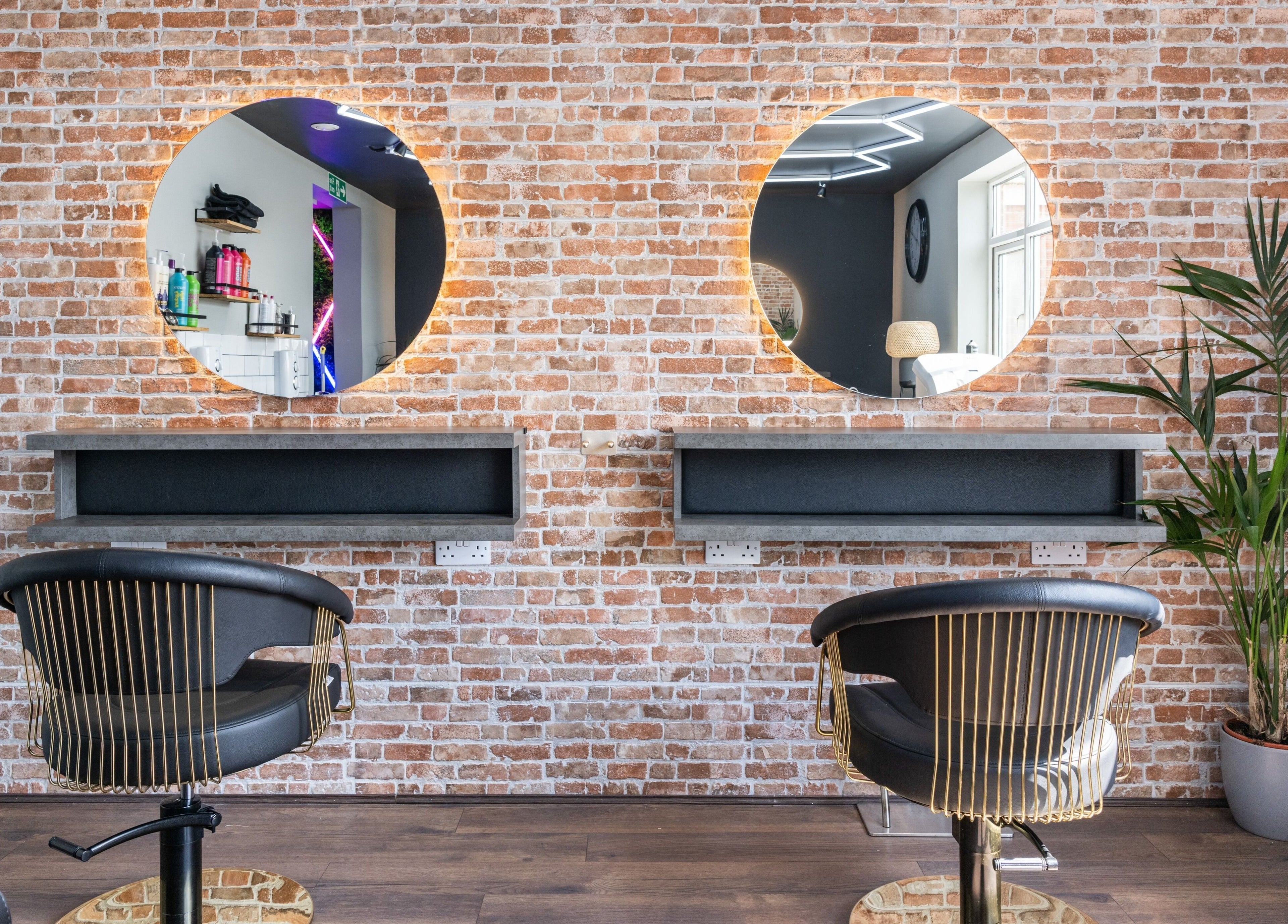 Stylish salon chairs and mirrors at Glam Factory, Nuneaton, England, GB, highlighting modern elegance.