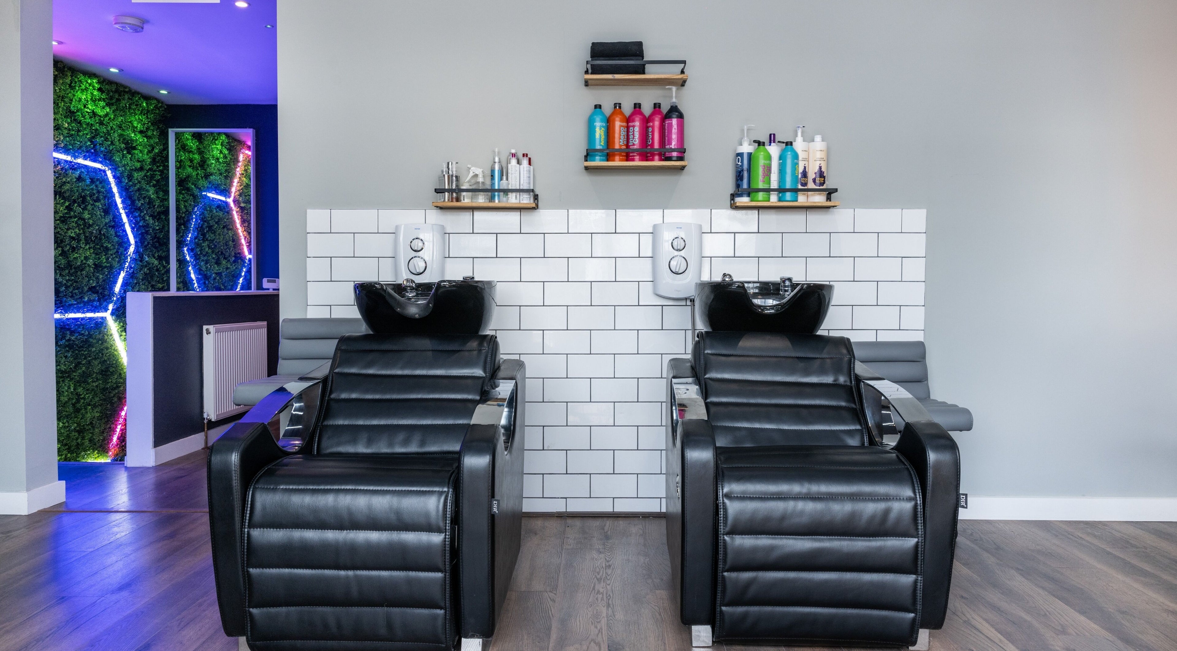 Glam Factory's sleek wash stations with vibrant decor in Nuneaton, England, GB.