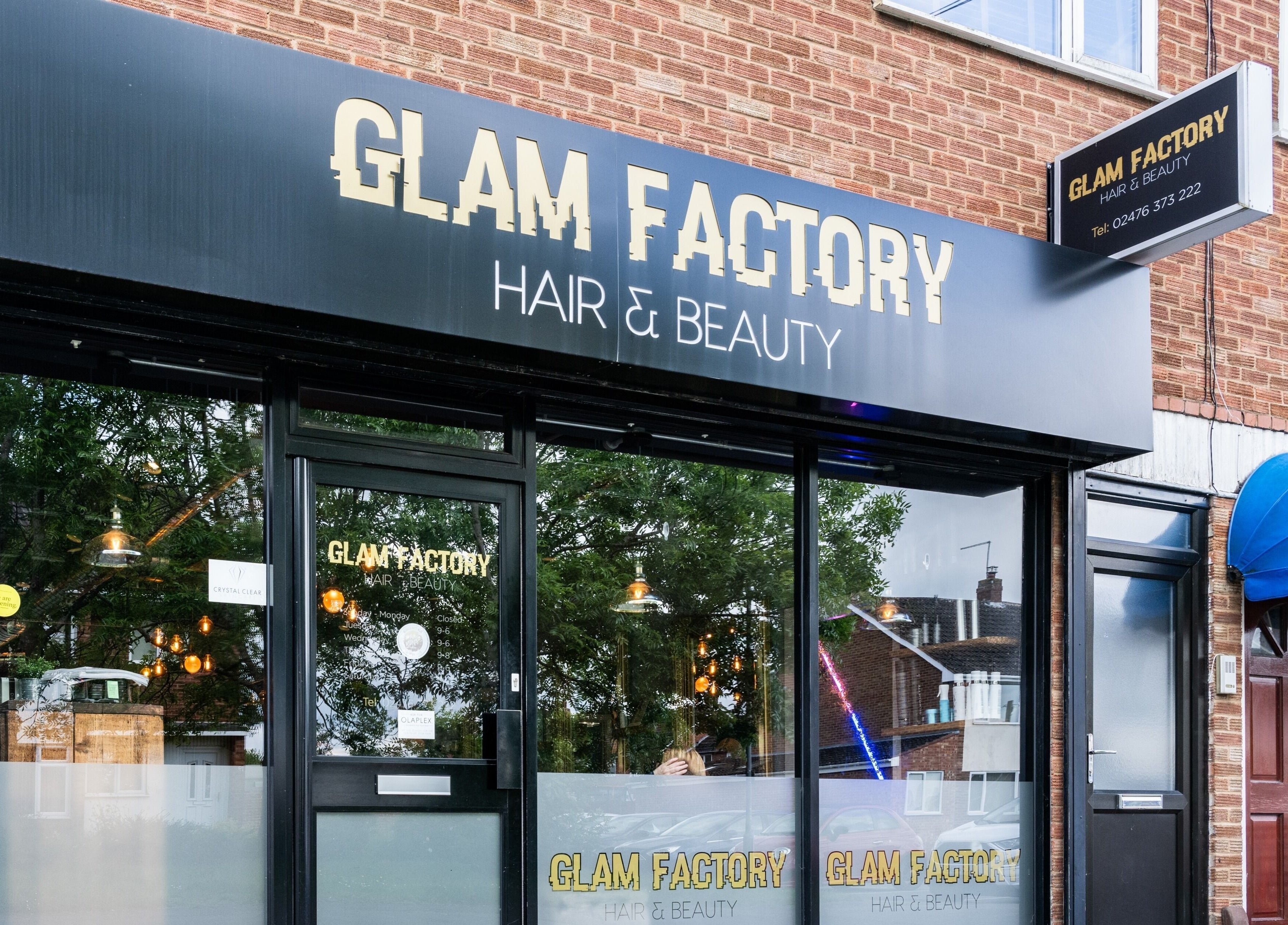 Front view of Glam Factory beauty salon in Nuneaton, England, showcasing its modern storefront.