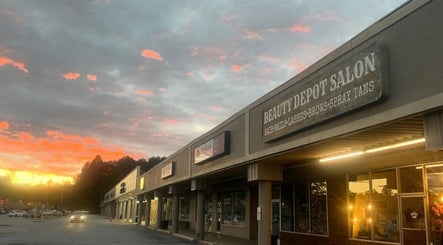 Beauty Depot Salon storefront at sunset in Blue Ridge, Georgia, US.