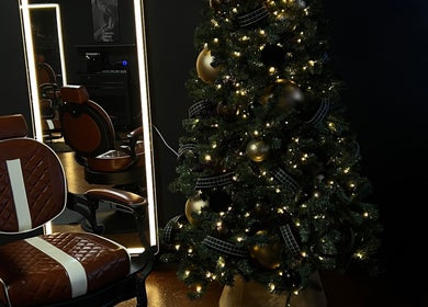 Elegant salon chair beside decorated Christmas tree at Razor in the Ridge, Blue Ridge, Georgia, US.