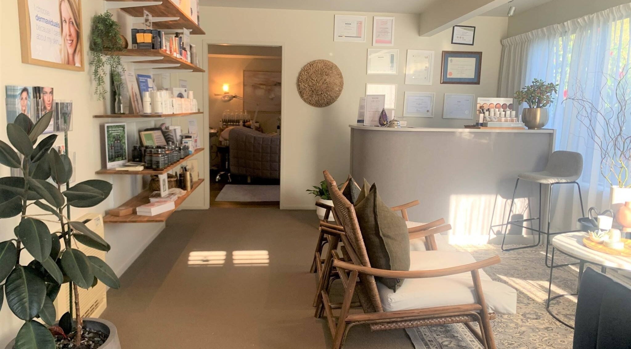 Reception area of Studio Eleven Skincare Clinic in Rotorua, Bay of Plenty, NZ, featuring natural decor and seating.