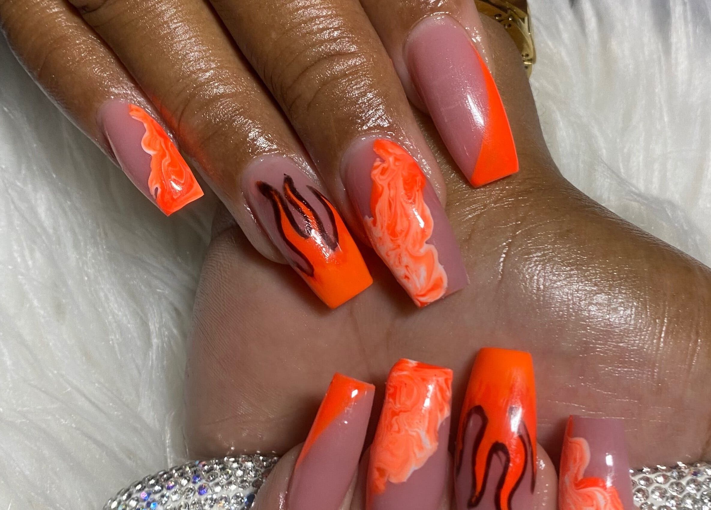 Bold orange nail design at Belle Luxe Spa, Saint Michael, Saint Michael, BB, showcasing intricate patterns.