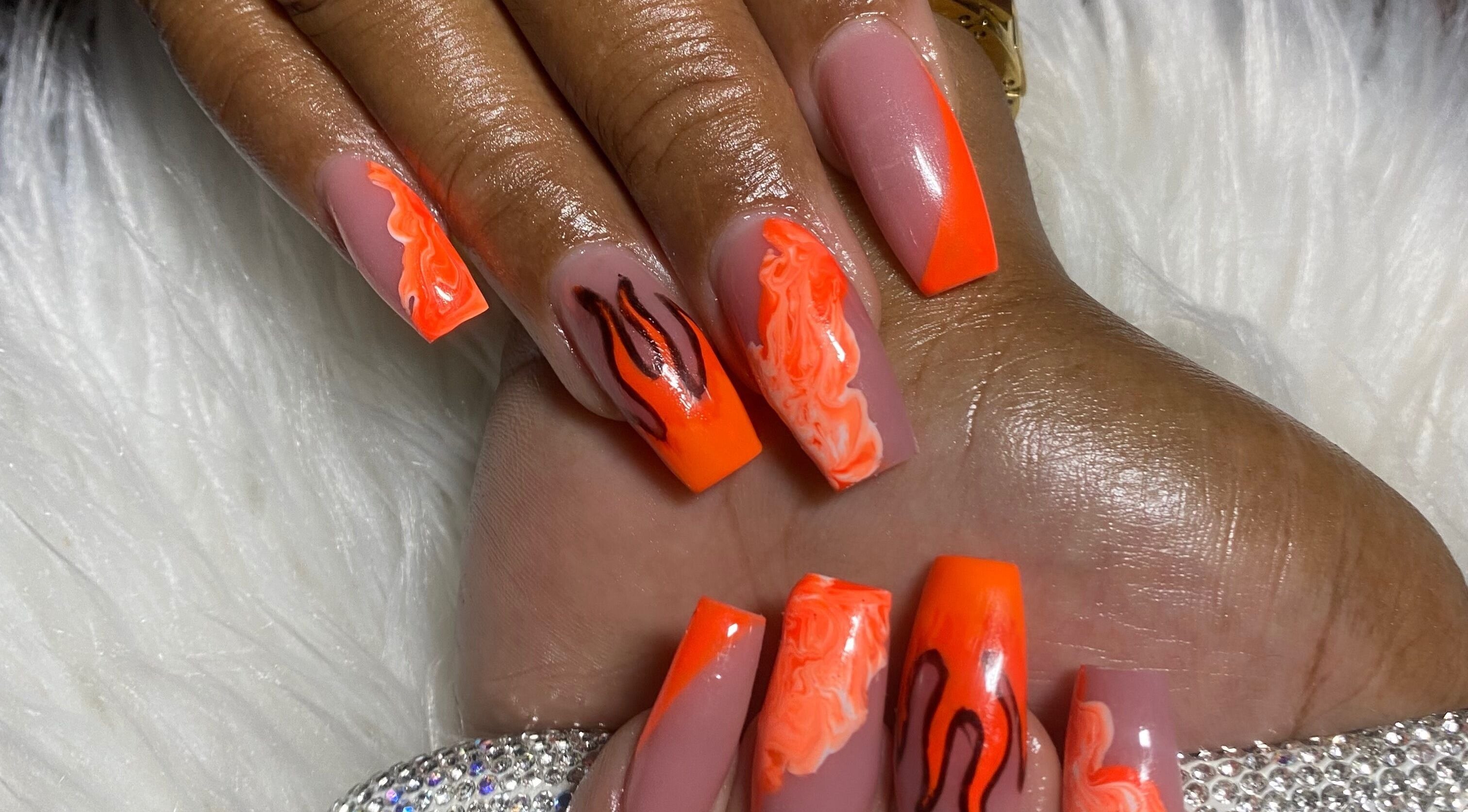 Bold orange nail design at Belle Luxe Spa, Saint Michael, Saint Michael, BB, showcasing intricate patterns.