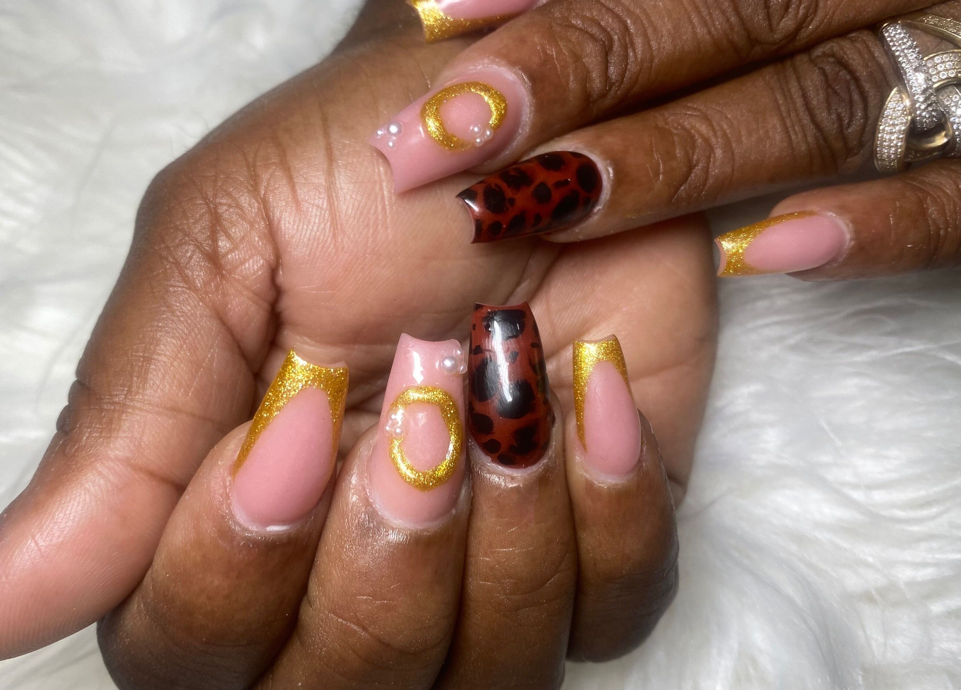Stylish nail art with gold and leopard patterns at Belle luxe spa, Saint Michael, Saint Michael, BB.