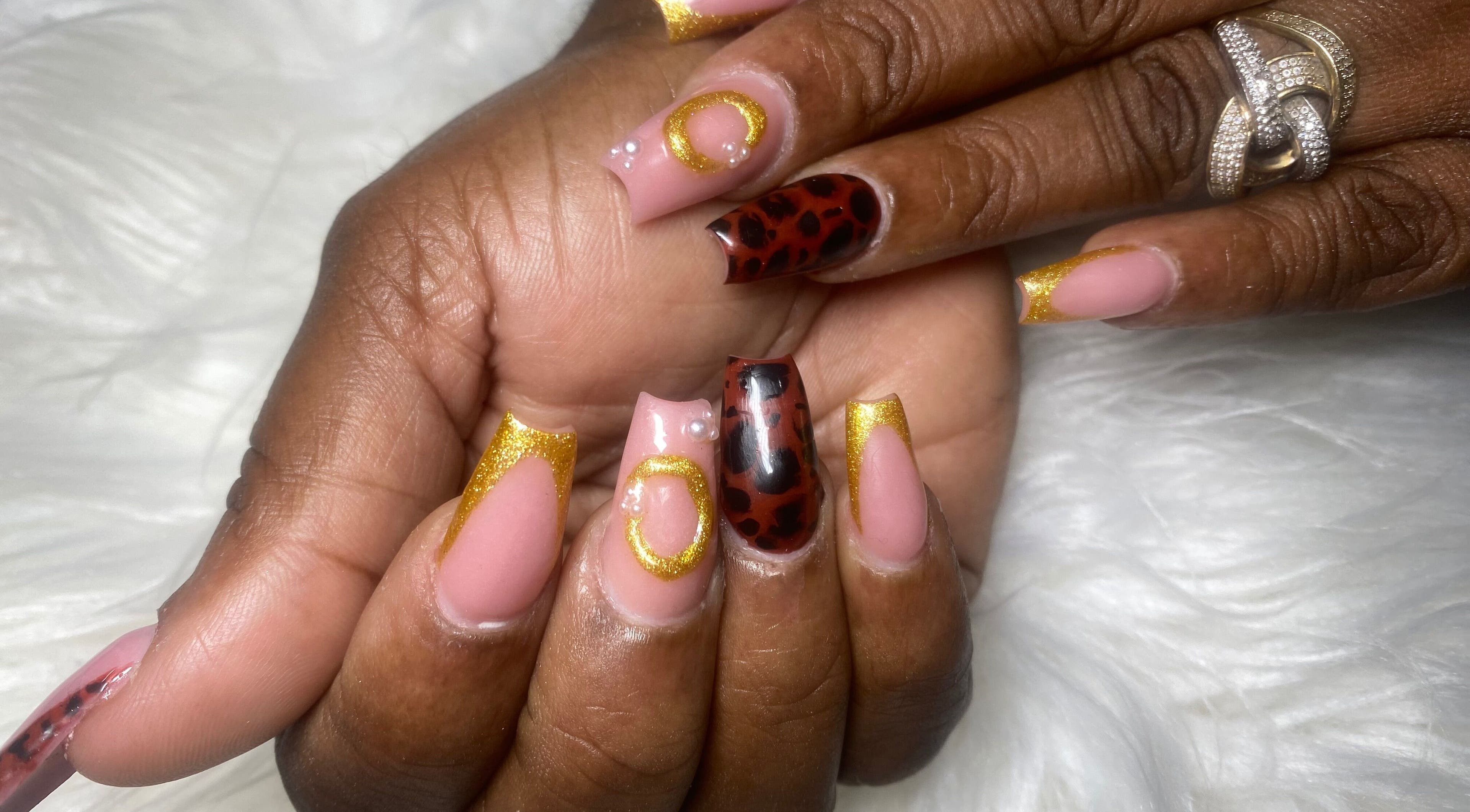 Stylish nail art with gold and leopard patterns at Belle luxe spa, Saint Michael, Saint Michael, BB.