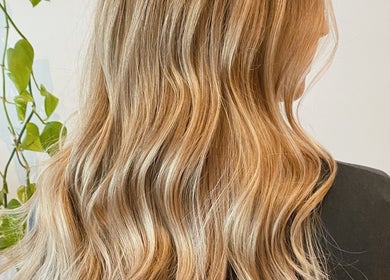 Lush blonde waves styled at Carly Jones salon in Victoria, British Columbia, CA.