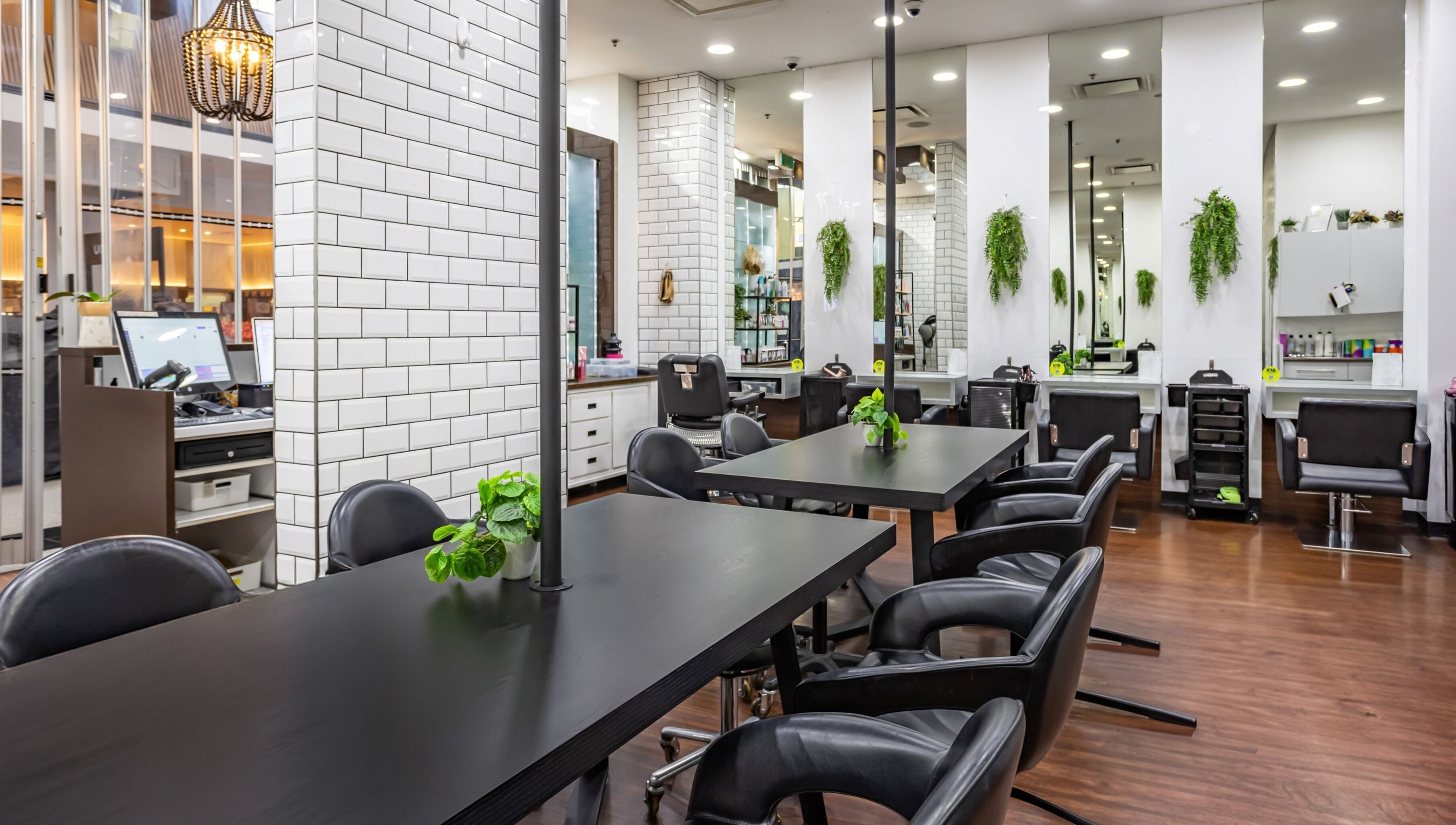 Contemporary salon at Magnifique Salon, Springfield Central, Queensland, AU with sleek chairs and modern decor.
