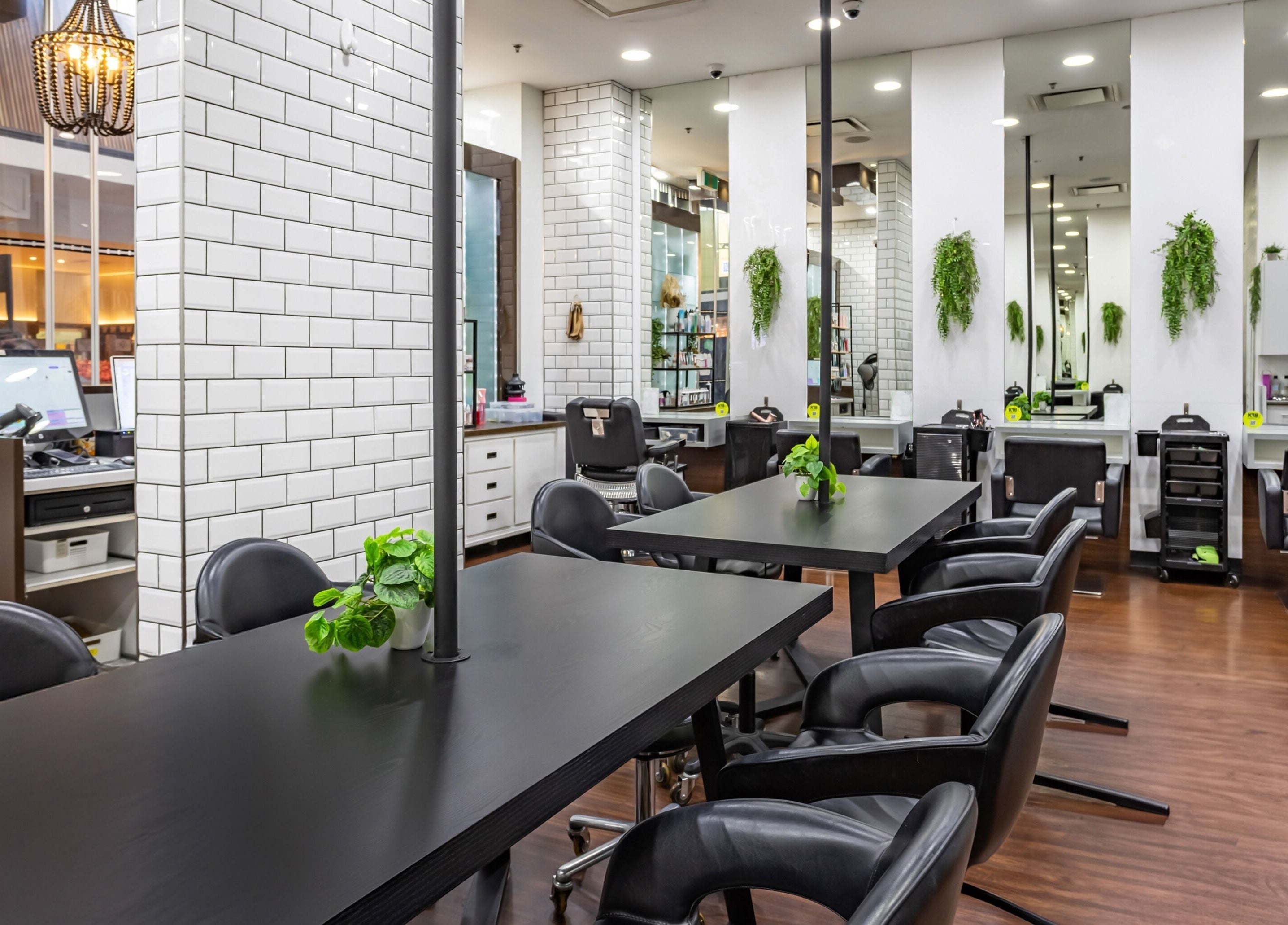 Contemporary salon at Magnifique Salon, Springfield Central, Queensland, AU with sleek chairs and modern decor.