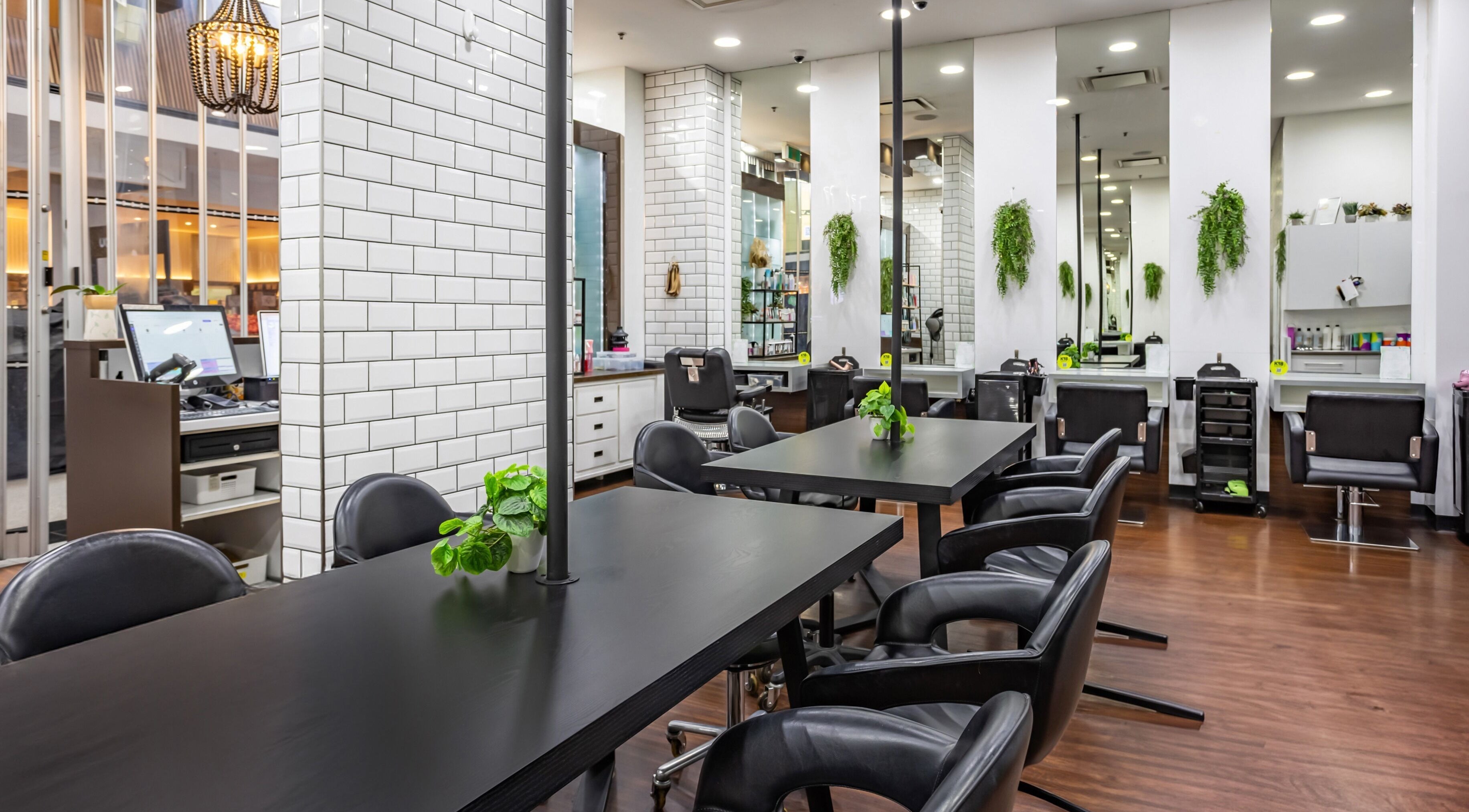 Contemporary salon at Magnifique Salon, Springfield Central, Queensland, AU with sleek chairs and modern decor.