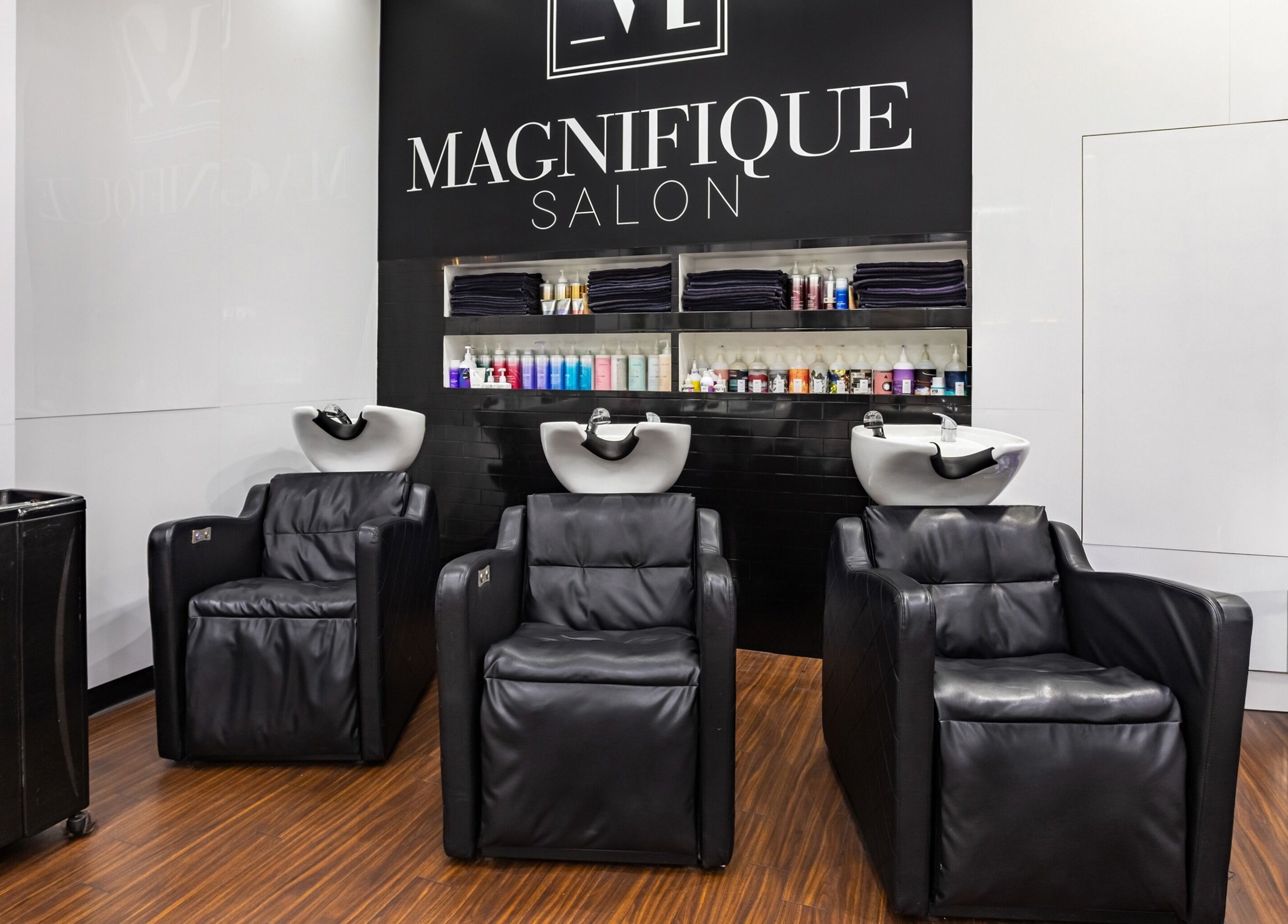 Luxurious wash stations at Magnifique Salon, Springfield Central, Queensland, AU. Modern elegance in hair care.
