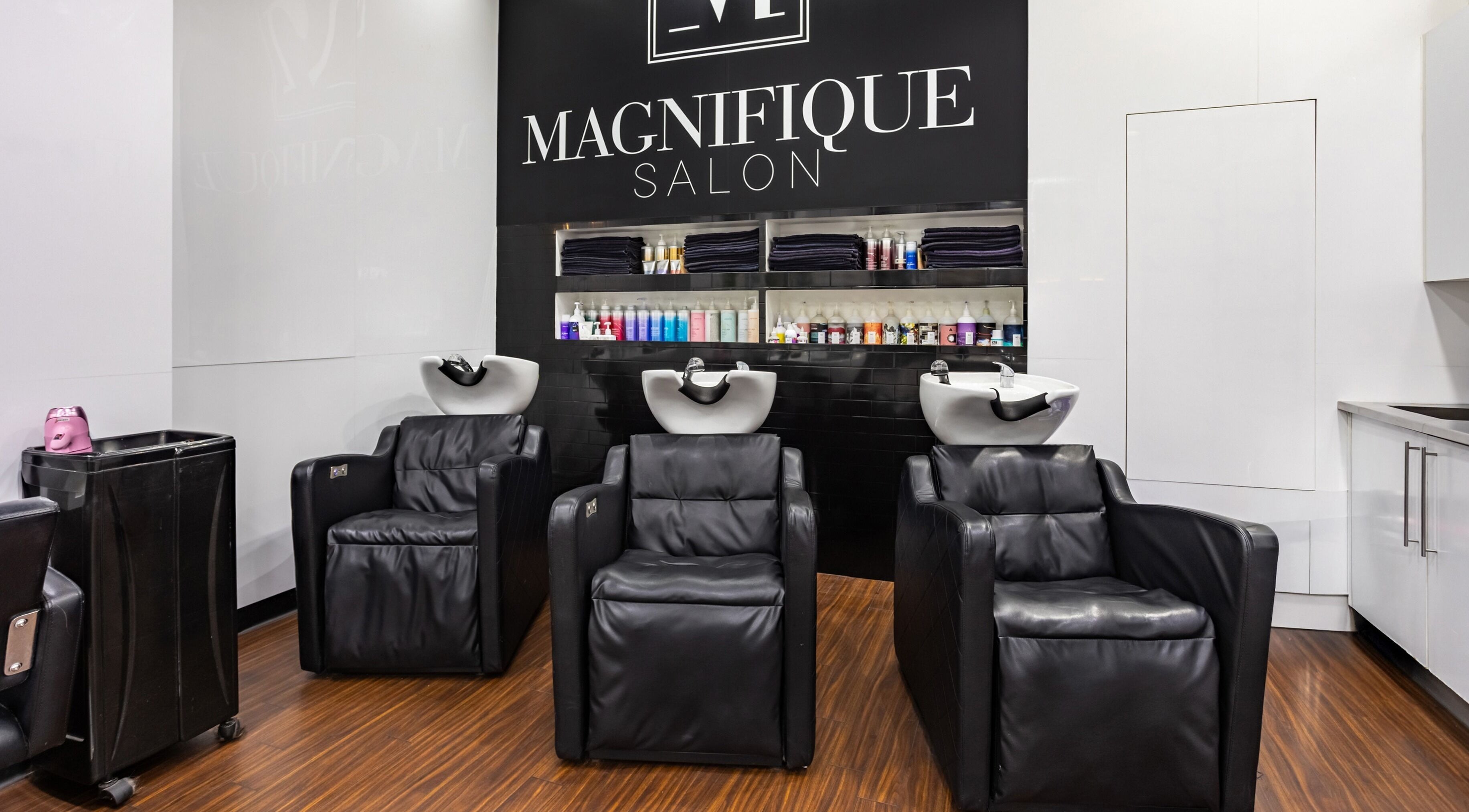 Luxurious wash stations at Magnifique Salon, Springfield Central, Queensland, AU. Modern elegance in hair care.