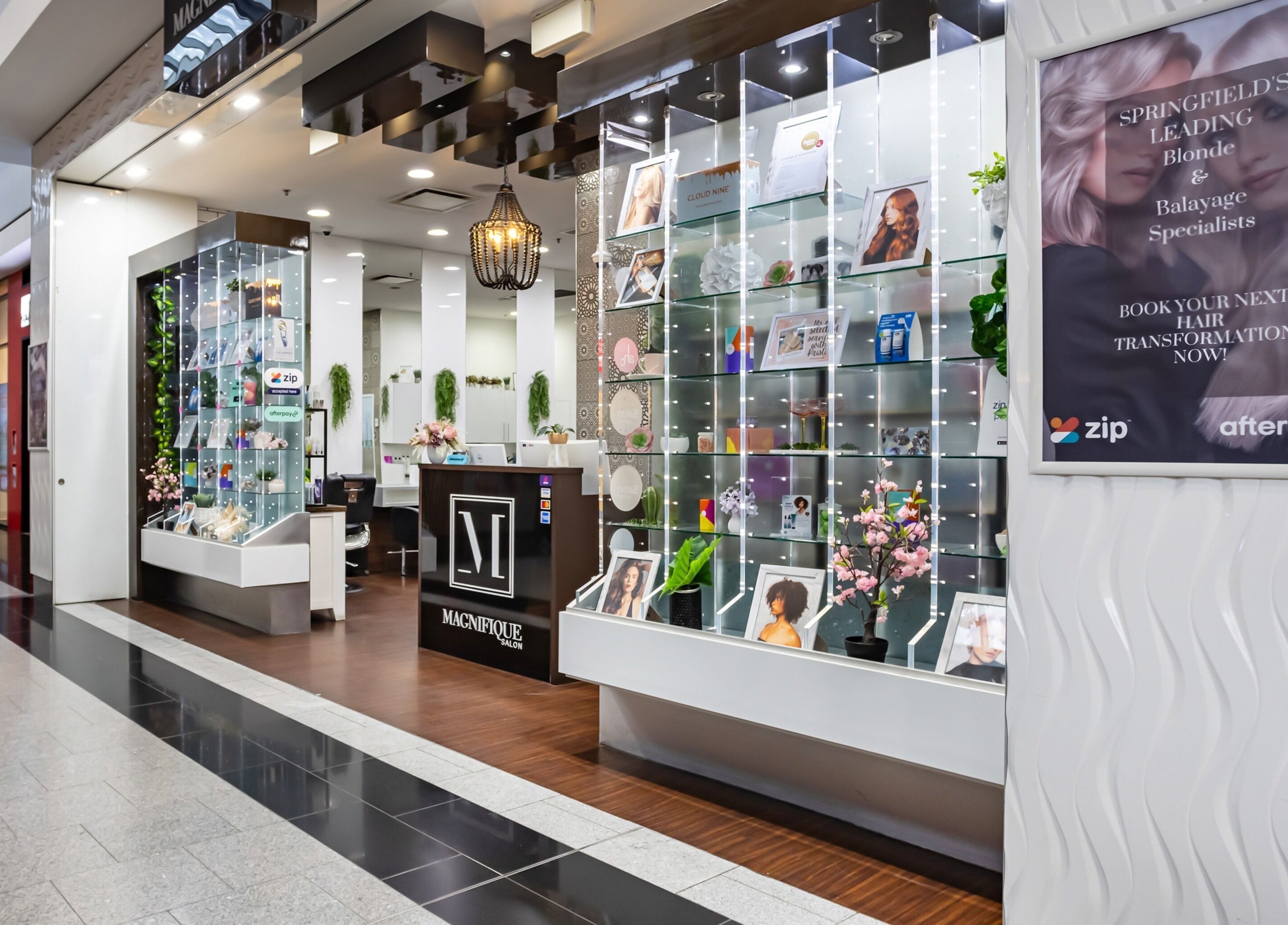 Entrance of Magnifique Salon in Springfield Central, Queensland, AU showcasing stylish interior and display.