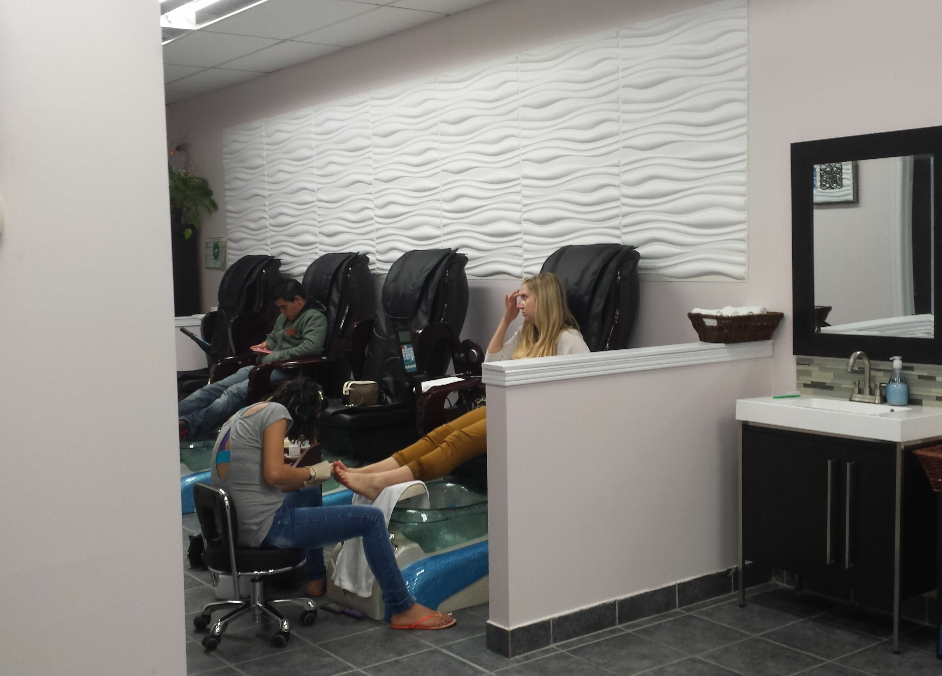 Relaxing pedicure at A.T. Nails in Mississauga, Ontario, CA with modern decor and comfortable chairs.