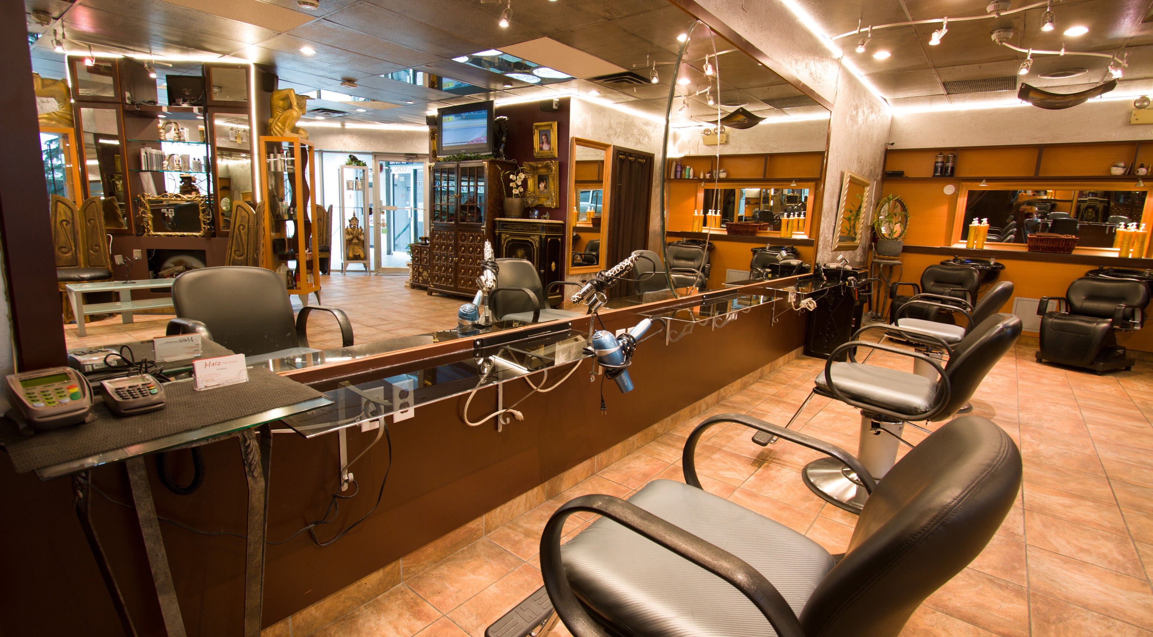 Modern salon interior at Hatz Hair Studio, North Vancouver, British Columbia, CA, featuring stylish hair stations.