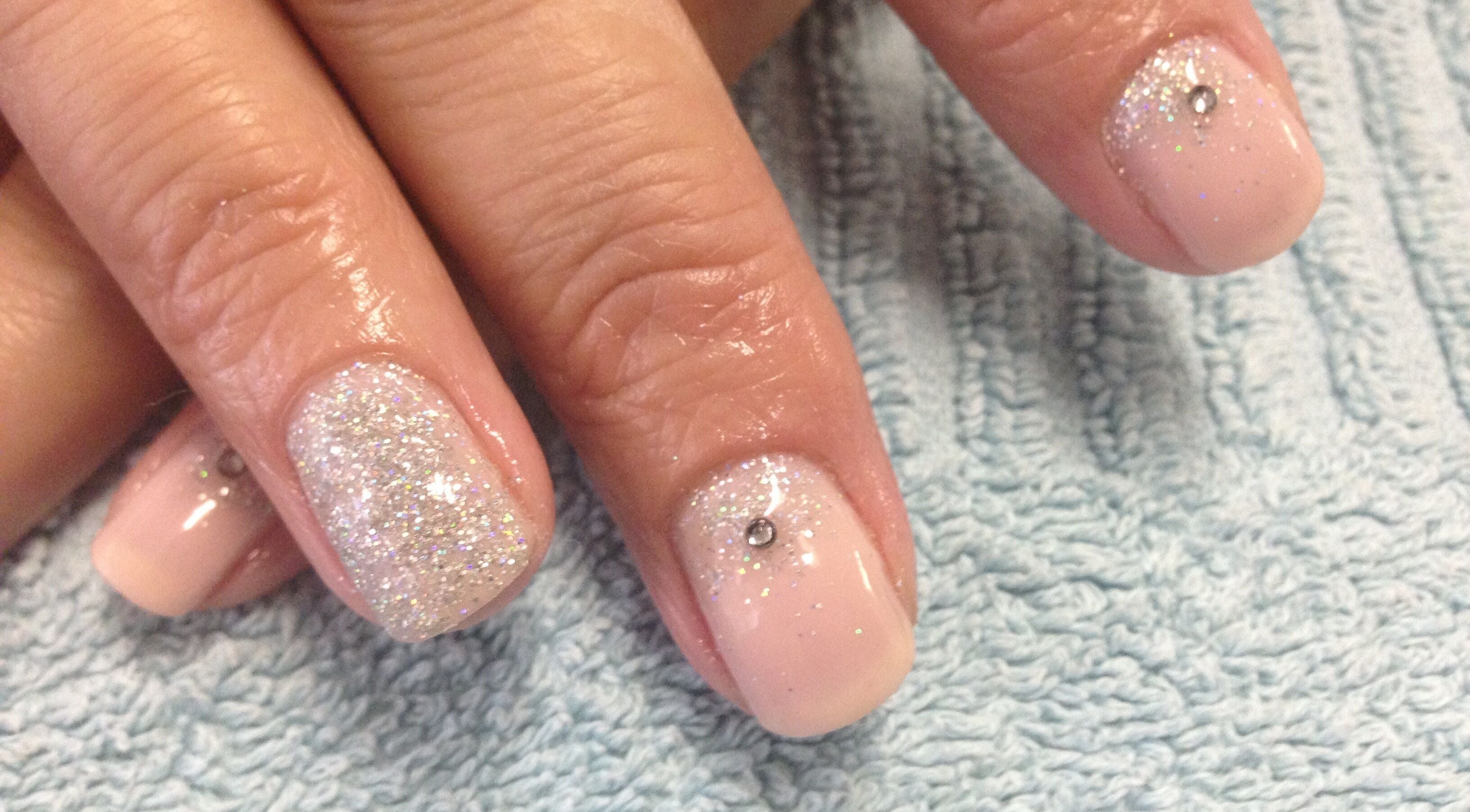 Elegant glittery manicure with rhinestones at Simply BeYoutiful, Cape Town, Western Cape, ZA.